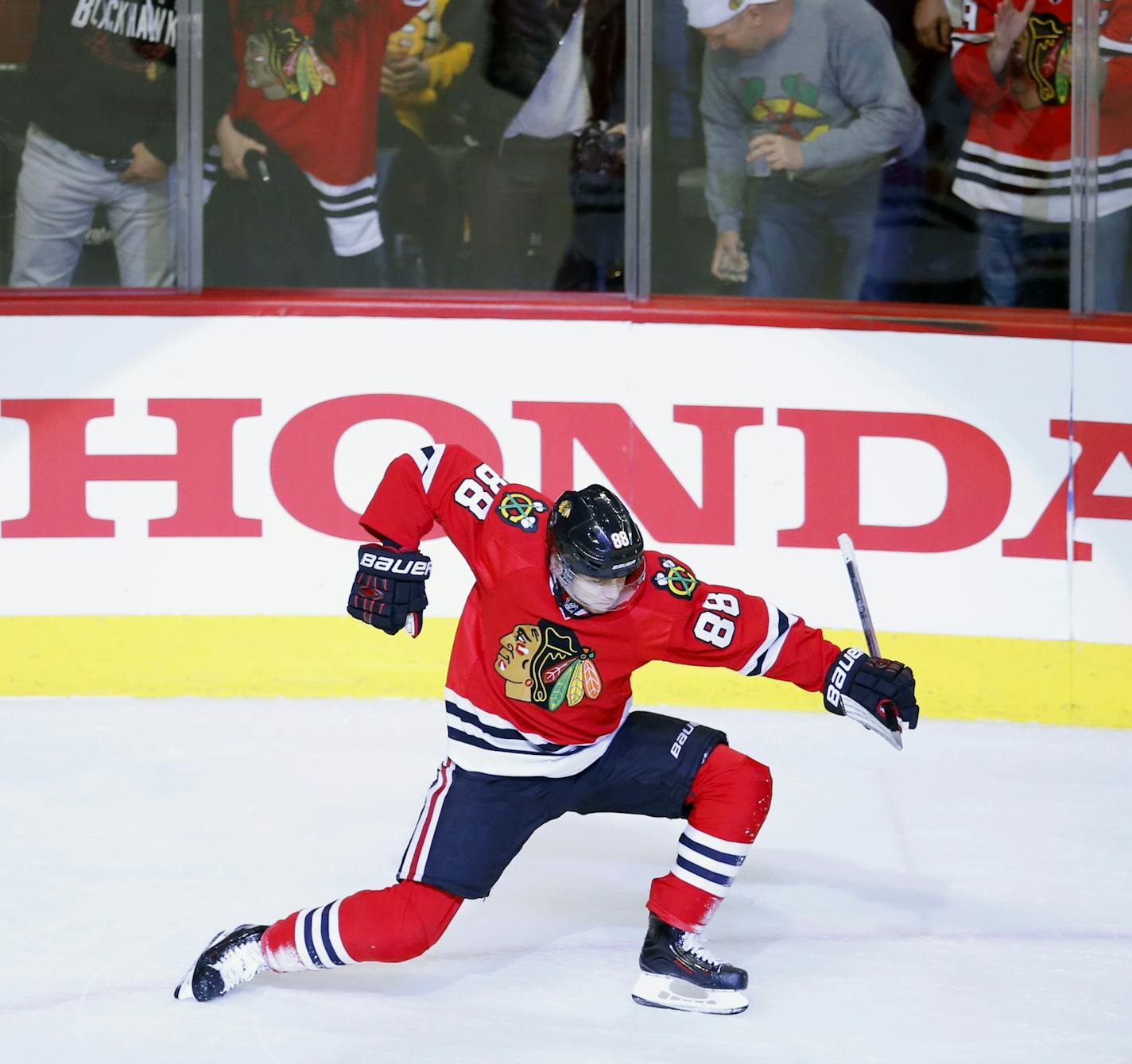 Chicago Blackhawks right wing Patrick Kane (88) celebrates his goal against the Boston Bruins during the first period of an NHL hockey game Sunday, April 3, 2016, in Chicago. (AP Photo/Jeff Haynes) ORG XMIT: MIN2016040901185869