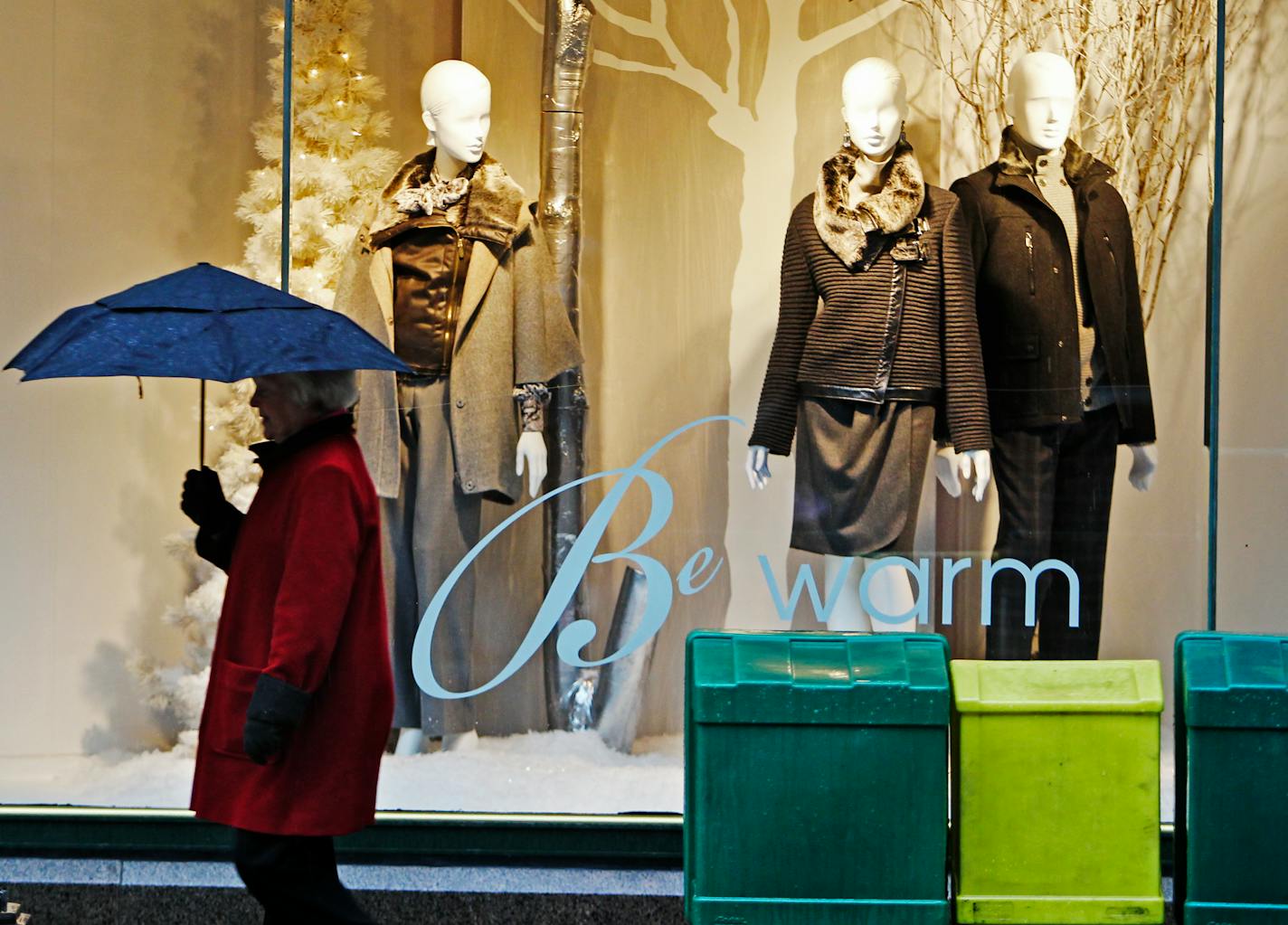 A shopper walks past a Christmas window display outside Macy's on the Nicollet Mall in this file photo.