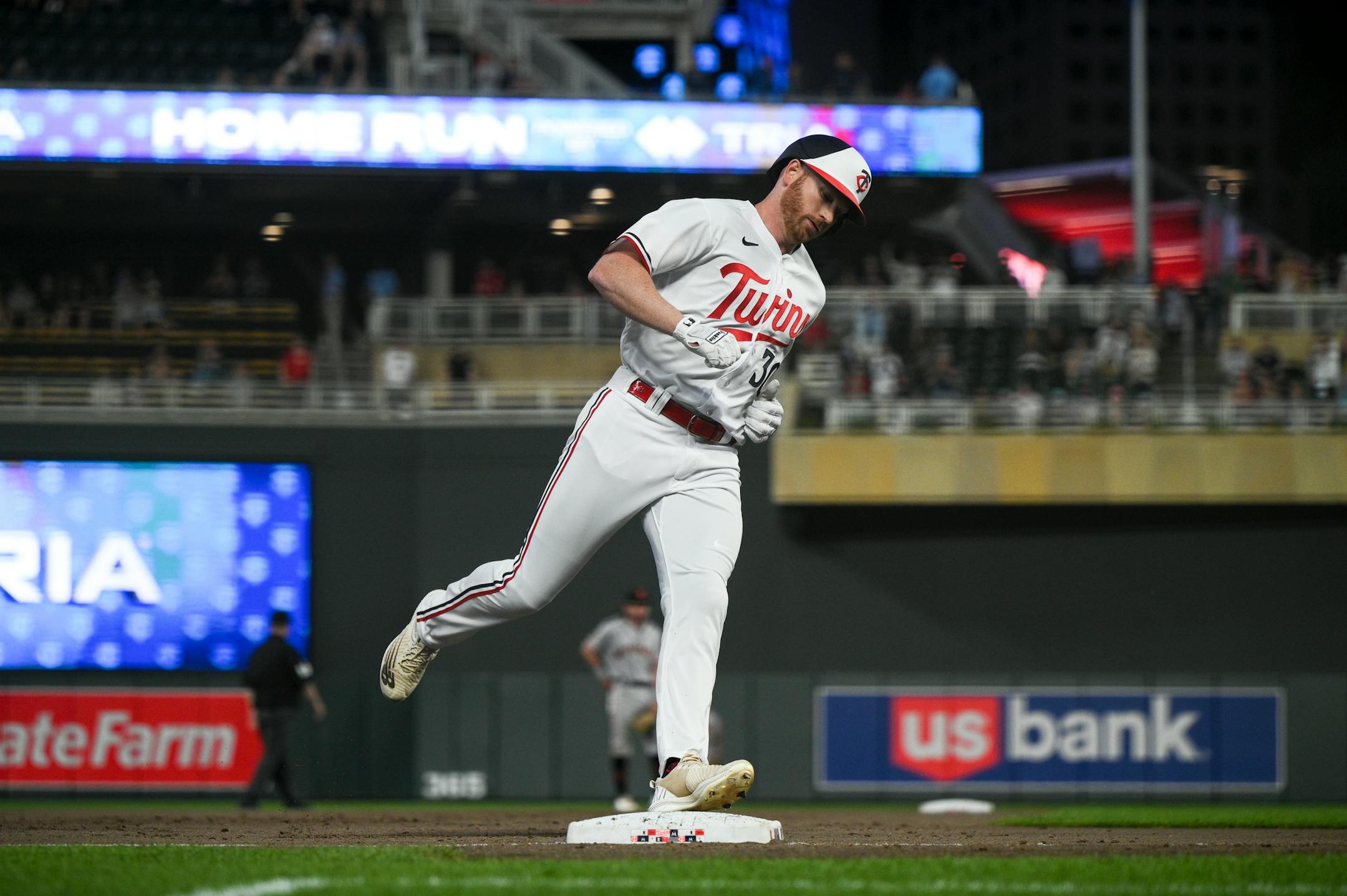 Minnesota Twins left fielder Kyle Garlick rounds the bases after a solo home run hit against the San Francisco Giants in the bottom of the eighth.