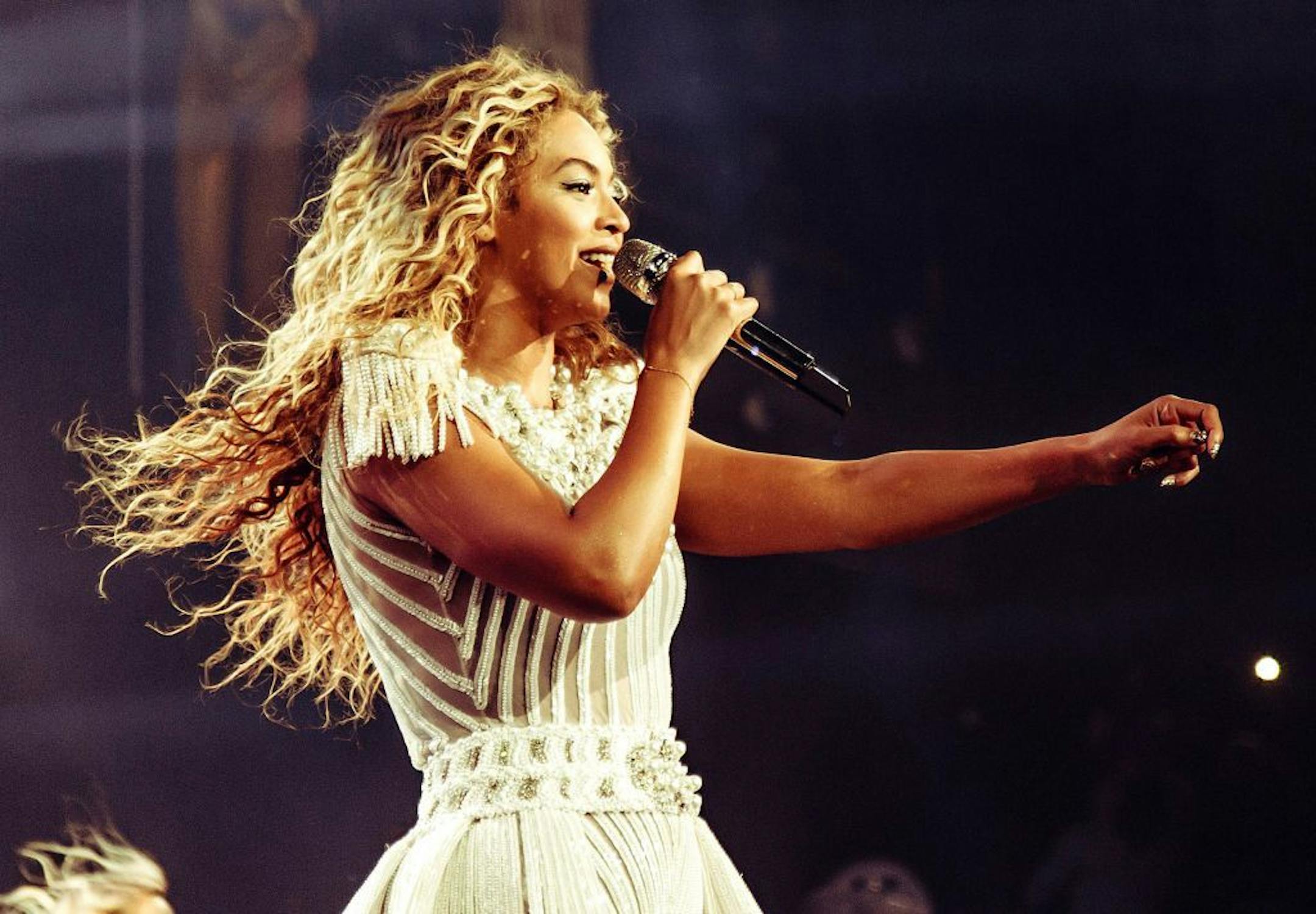 This publicity image released by Parkwood Entertainment shows singer Beyonce performing during her world tour on Saturday, July 13, 2013 at the Bridgestone Arena in Nashville, Tenn. Beyonce called for a moment of silence for Trayvon Martin during a concert just hours after George Zimmerman was found not guilty by a Florida jury on Saturday. After asking the crowd to be silent a moment, she sang the chorus of �I Will Always Love You,� a song written by country music star Dolly Parton and brought