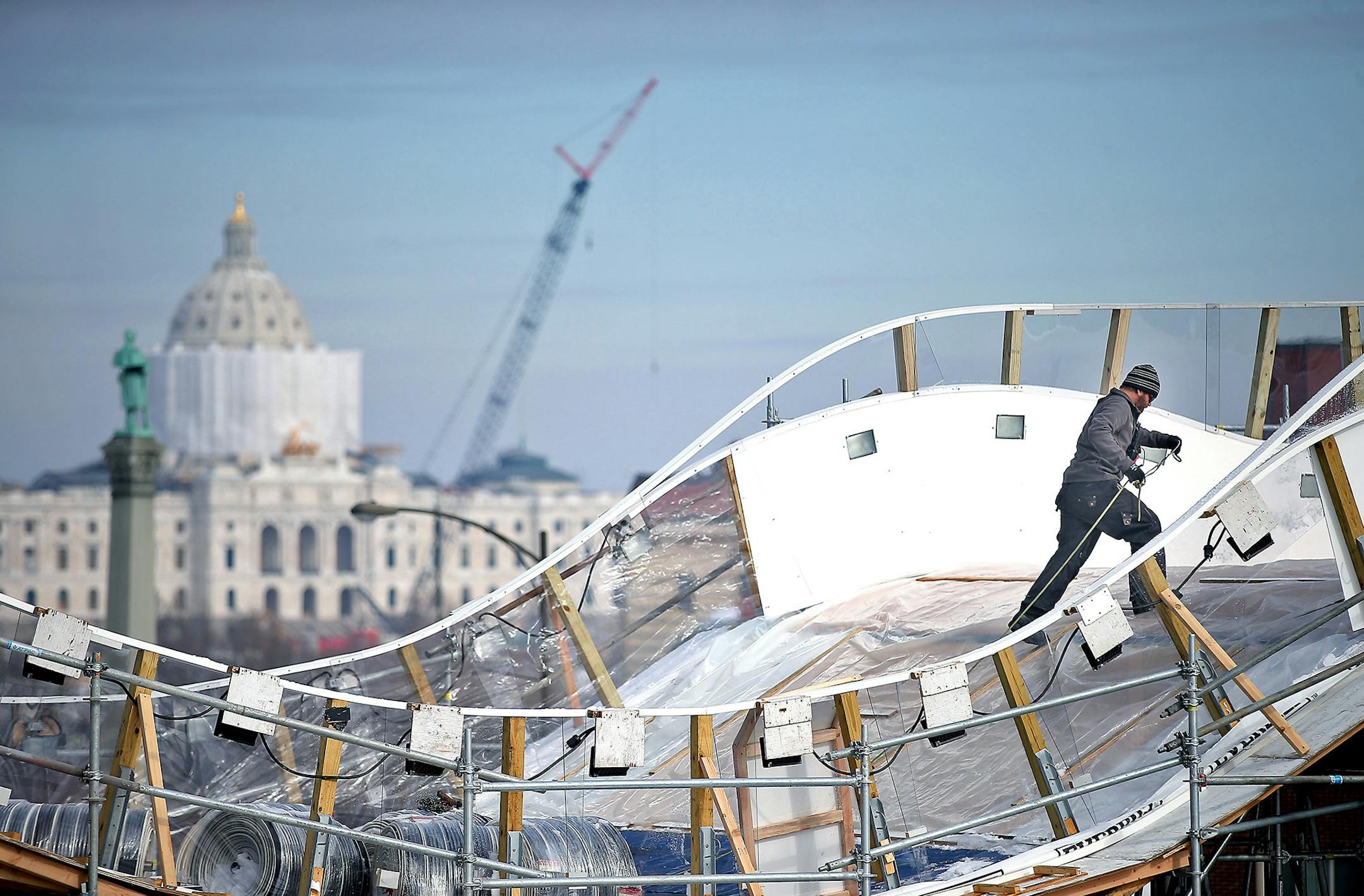 With the site of the Sate Capitol looming in the background, construction went underway at the Cathedral of St. Paul in preparation for the Red Bull Crashed Ice World Championships, Monday, February 15, 2016 in St. Paul, MN. The event will take place for the fifth straight year Feb. 26-27, 2016. ] (ELIZABETH FLORES/STAR TRIBUNE) ELIZABETH FLORES ï eflores@startribune.com ORG XMIT: MIN1602151237280178