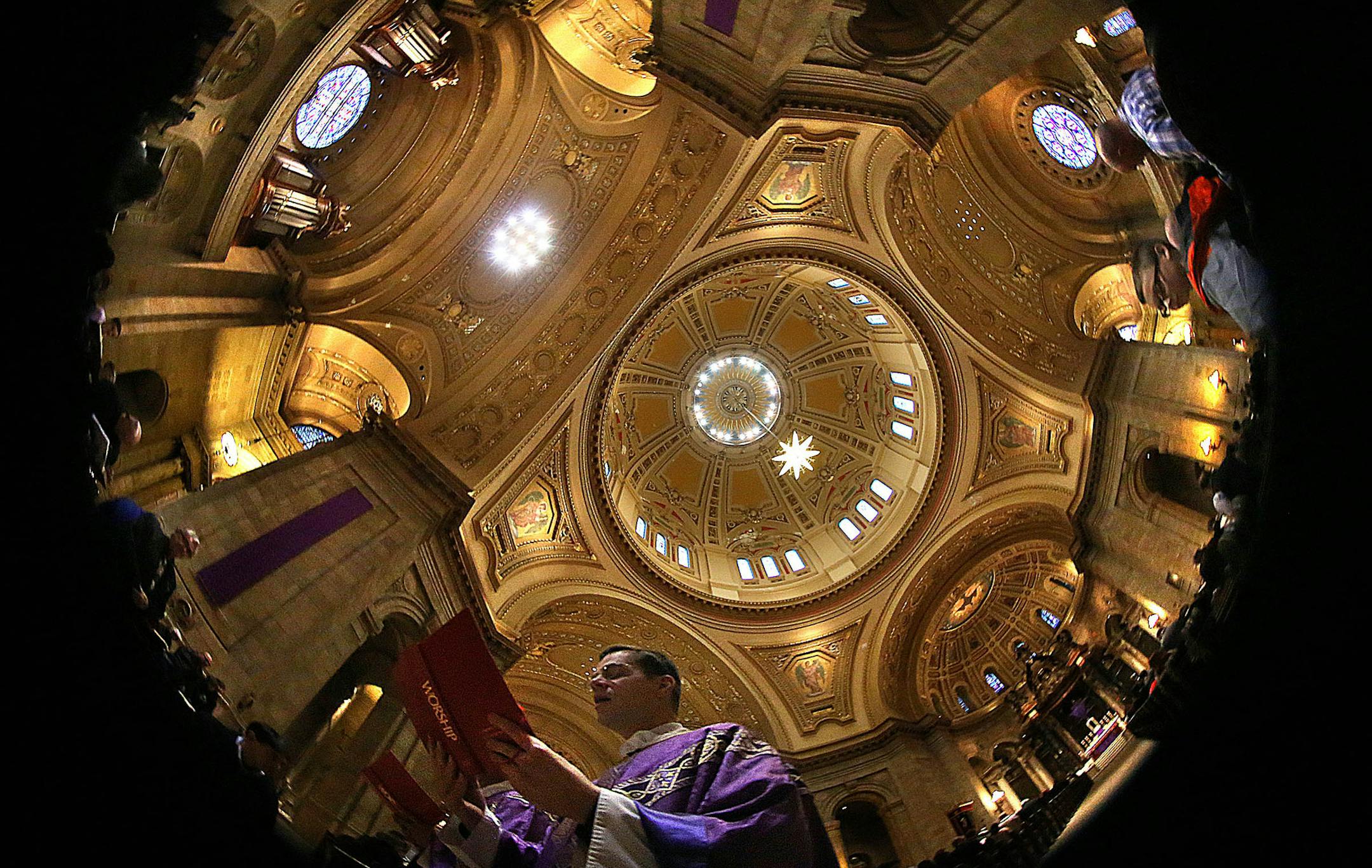 Cathedral of St. Paul Rector Father John Ubel processed from the Sanctuary as the Sunday Mass concluded. ] JIM GEHRZ &#xef; james.gehrz@startribune.com / Minneapolis, MN / March 22, 2015 /9:00 AM - BACKGROUND INFORMATION: On Palm Sunday, the Cathedral of St. Paul, the iconic, domed Catholic church overlooking the city, turns 100 years old. We look at the history of the place, the effort it took to build it and the yearlong events that are planned to mark the centennial.