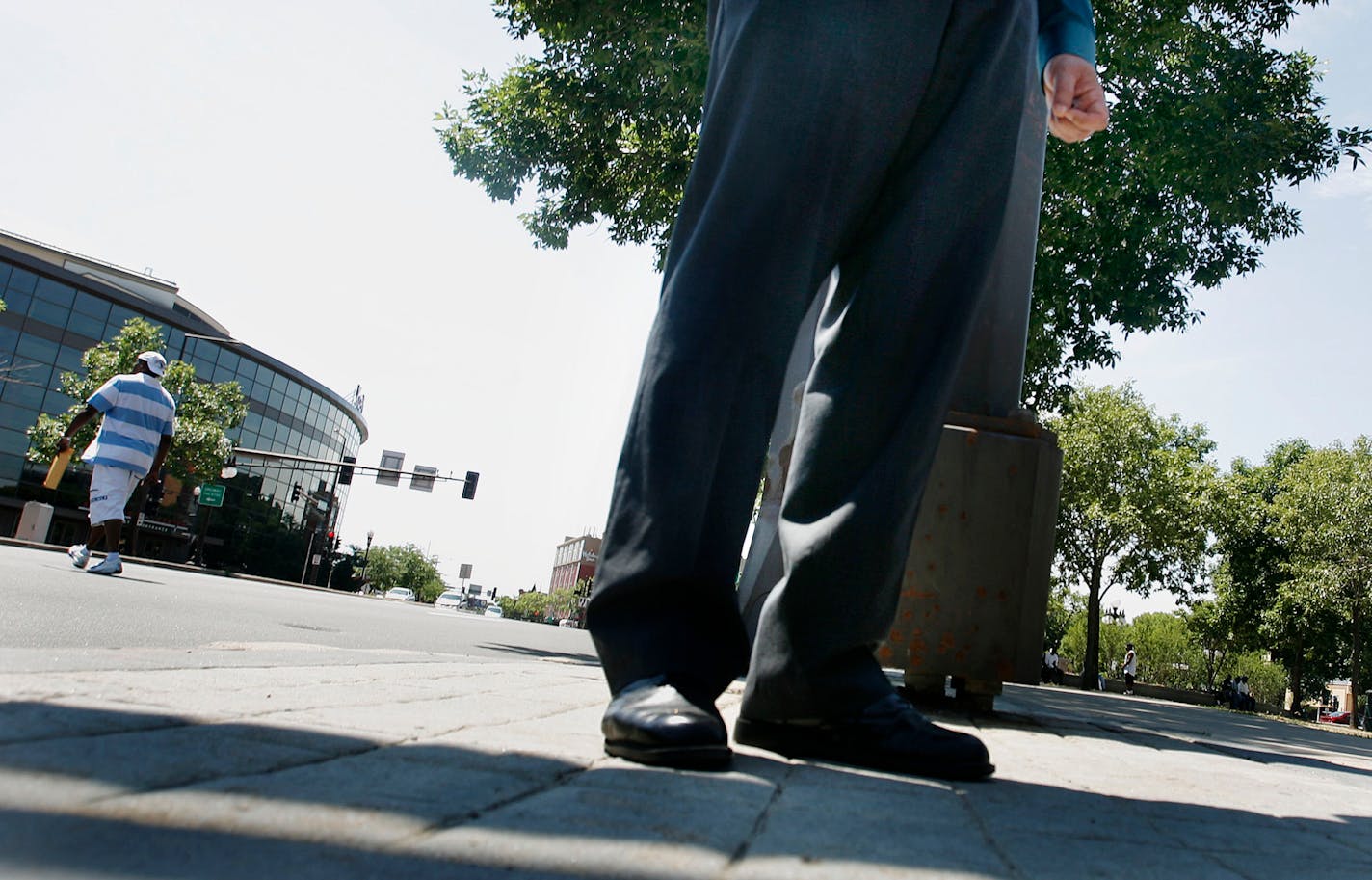 A pedestrian crossed W. 7th Street, across from the Xcel Energy Center, on Wednesday near the spot where the city plans to set up a viewing area for the public and protesters. "We're all gonna be close friends by the time this is over," said Paul Walsh, a police information officer.