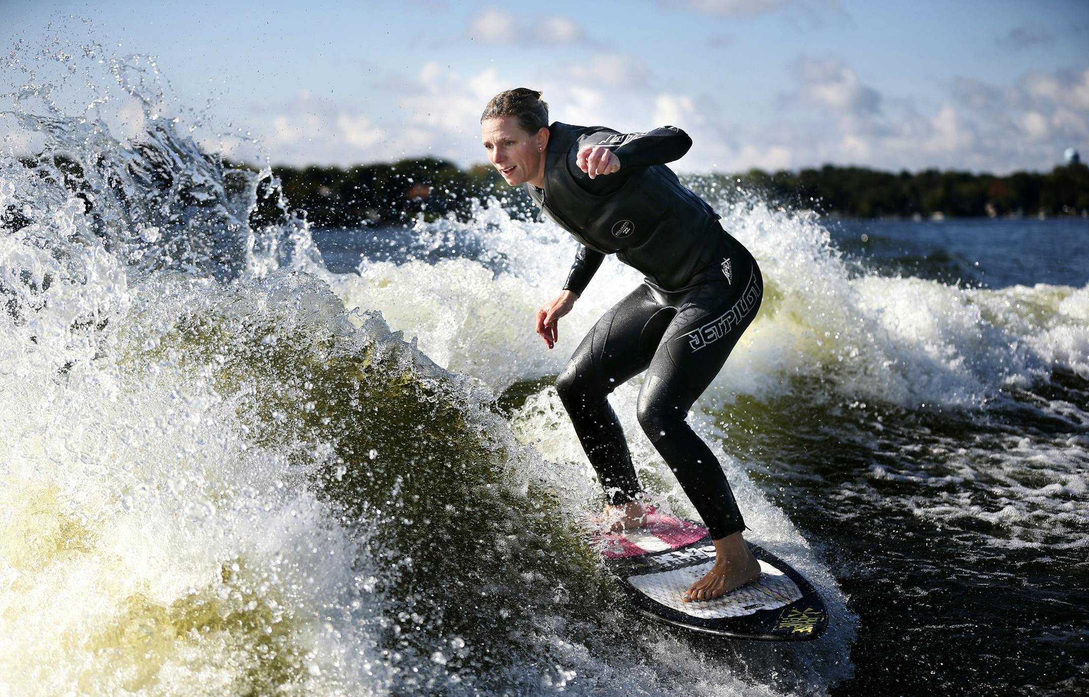 Stacia Bank, the current number one-ranked pro woman wake surfer practiced on Lake Minnetonka Monday September 15 , 2014 in Wayzata ,MN. Ten local wake surfers will compete Sept. 26-27 in a world competition. ] Jerry Holt Jerry.holt@startribune.com