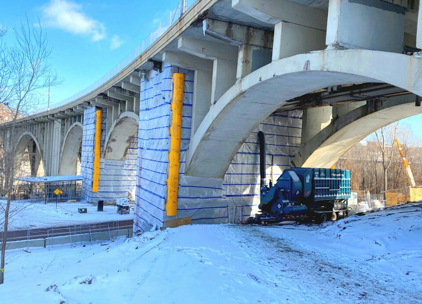 Workers have started removing crumbling concrete from the 10th Avenue Bridge in Minneapolis. It should reopen in summer 2021.