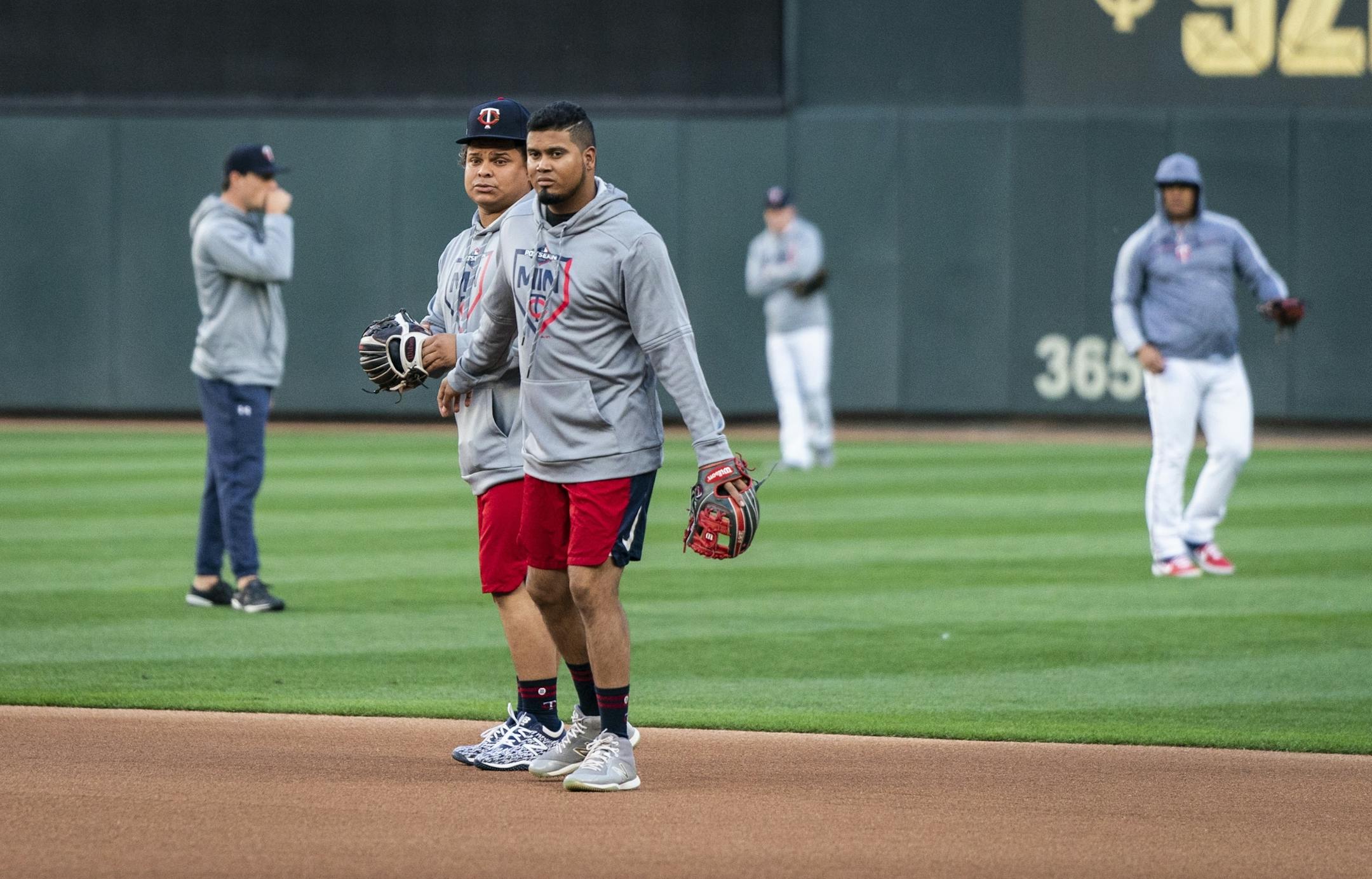 Minnesota Twins catcher Willians Astudillo, left, and Minnesota Twins second baseman Luis Arraez (2) fielded balls in the infield during the Twins workout.