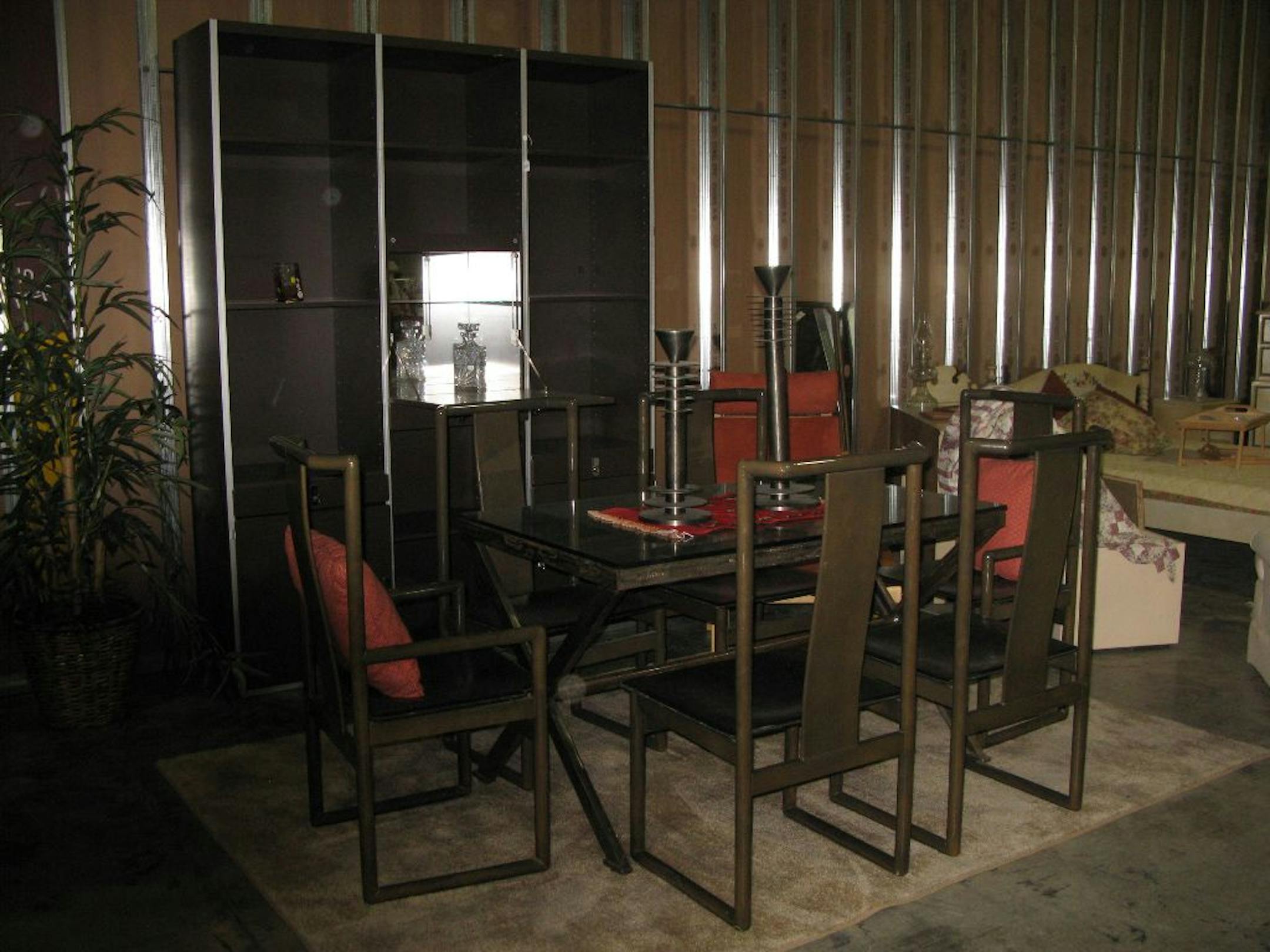 At the Angel's Attic sale, a contemporary dining room table is $125, the set of six chairs is $225 and the matching wall unit $100.