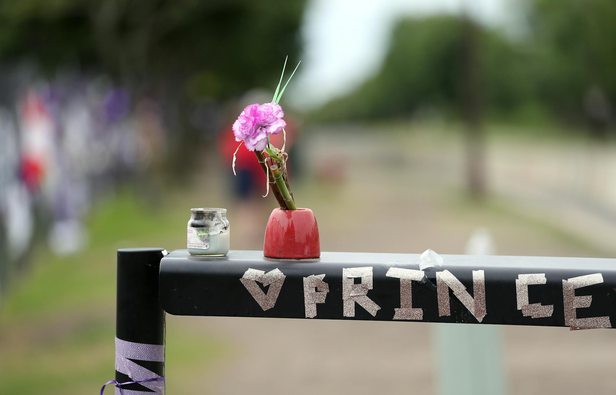 The memorial at Paisley Park. ] (Leila Navidi/Star Tribune) leila.navidi@startribune.com BACKGROUND INFORMATION: At Paisley Park in Chanhassen on July 4, 2016. More than two months after Prince's untimely death at Paisley Park, what is the scene at his home and recording studio, where pilgrims flocked in the days and weeks after his death? The fences overflowed with tributes; what do they look like now?