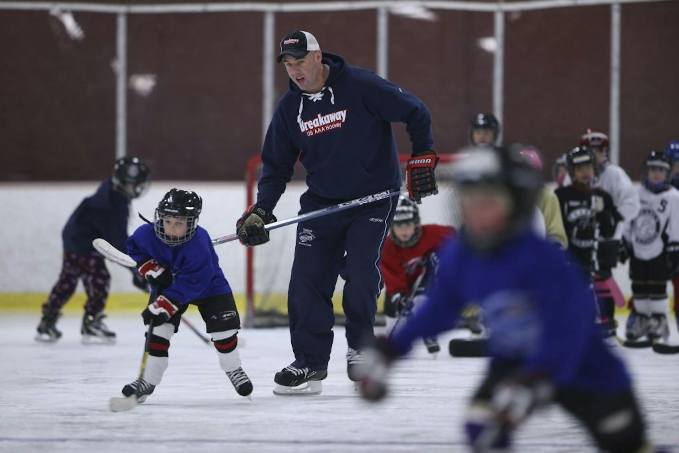 The upside of the NHL players being on strike is that linesman Brian Mach is able to be with his kids a lot more. He is also helping to coach a youth hockey skills camp that both his boys are participating in at Chaska Community Center.
