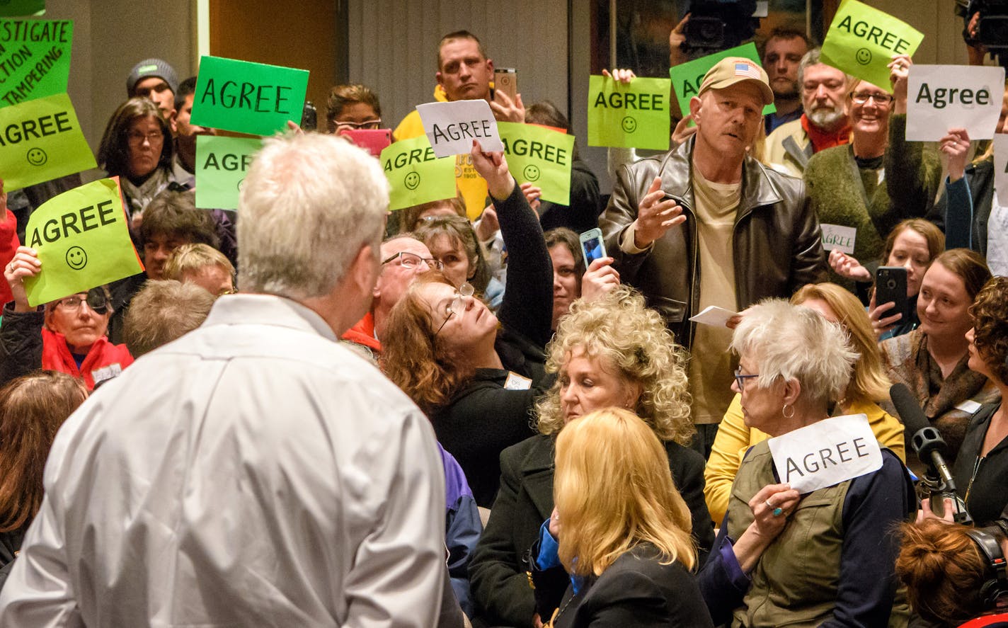 The crowd held up "Agree" signs as an attendee demanded an investigation into the Trump administration's ties to Russia. Rep. Tom Emmer hold his first town hall of the year in Sartell. ] GLEN STUBBE &#x2022; glen.stubbe@startribune.com Wednesday February 22, 2017 Rep. Tom Emmer holds his first town hall of the year in Sartell. Expecting a large turnout, similar to what's been happening around the country as people have turned out to challenge President Trump's actions and see how their represent