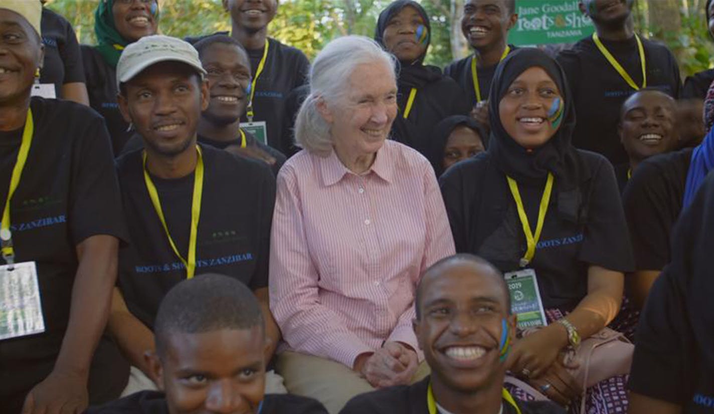 Dr. Jane Goodall posing with members of Roots & Shoots, a program of the Jane Goodall Institute. National Geographic's JANE GOODALL: THE HOPE picks up where JANE (2017) left off, following Jane Goodall through three generations of advocacy work as she meets with everyone from schoolchildren in Zanzibar to Prince Harry and spreads a message of hope in a time of immense environmental change. (National Geographic/Bill Wallauer)