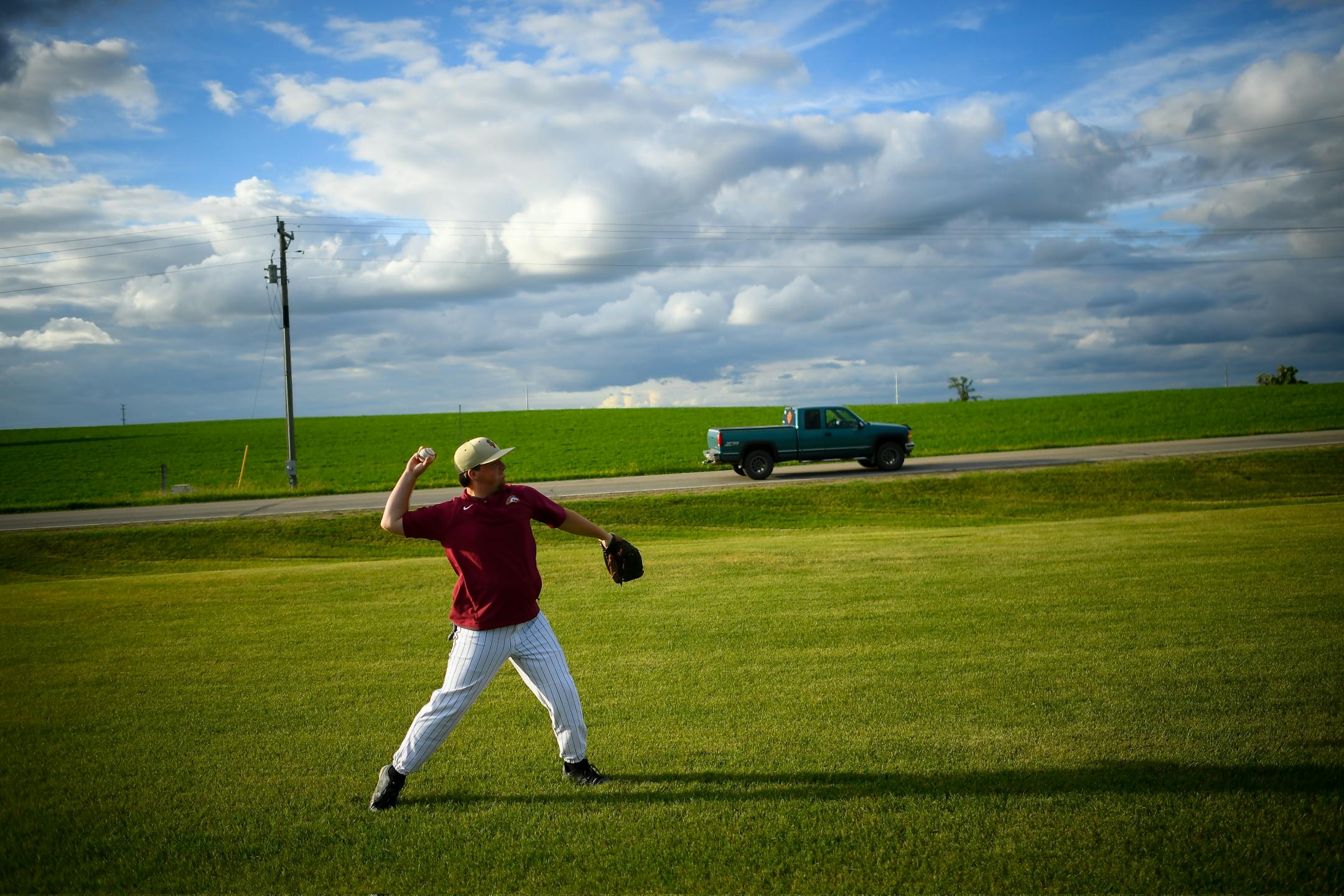 Andrew Kinney, a pitcher with the Sauk Valley League's Sartell Stone Poneys, warmed up his arm during a game against the Atwater Chuckers on Friday, June 23, 2017 during the Farming Invitational Tournament in Farming, Minn.