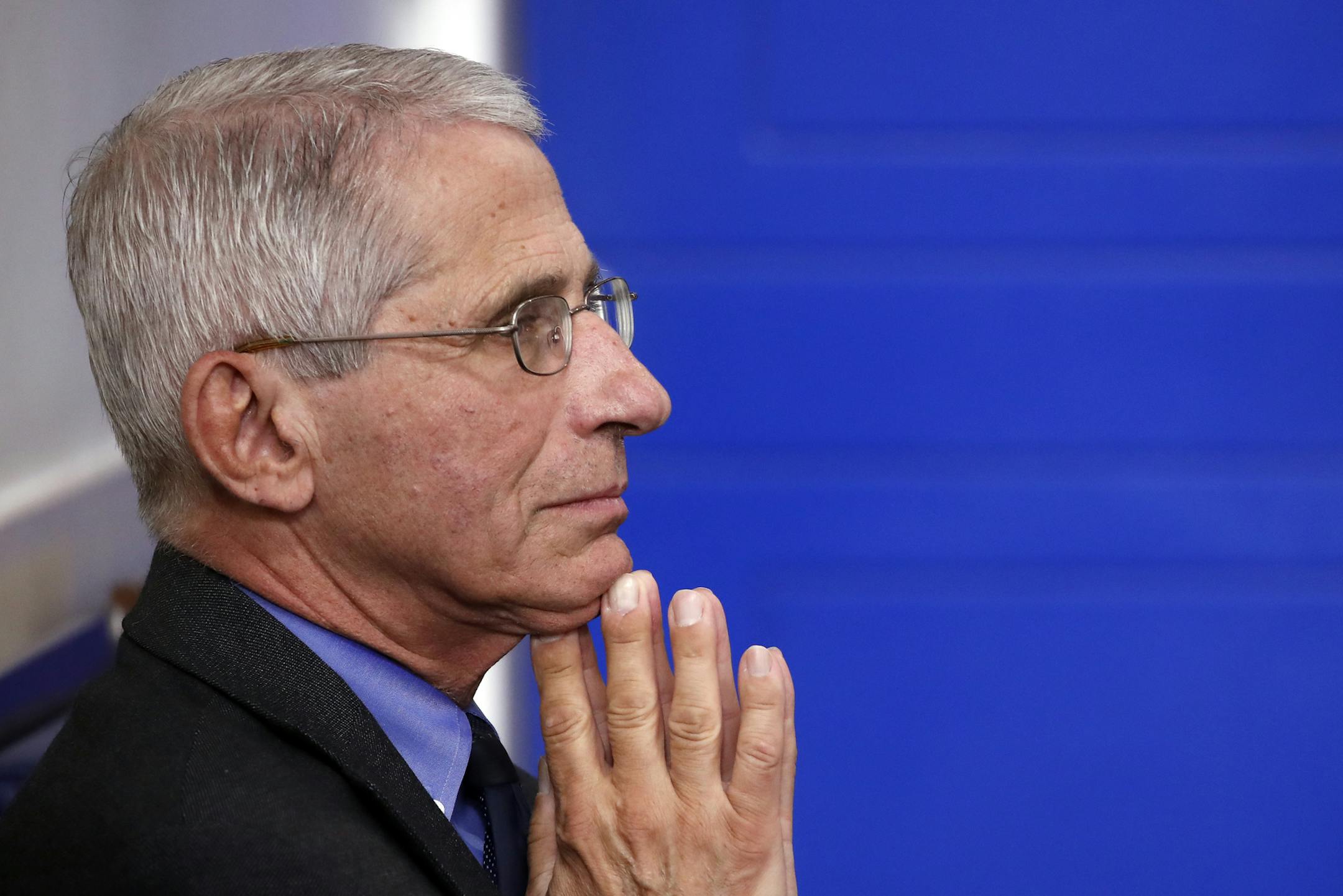 Dr. Anthony Fauci, director of the National Institute of Allergy and Infectious Diseases, waits for President Donald Trump to arrive and speak about the coronavirus in the James Brady Press Briefing Room of the White House, Tuesday, April 7, 2020, in Washington. (AP Photo/Alex Brandon)