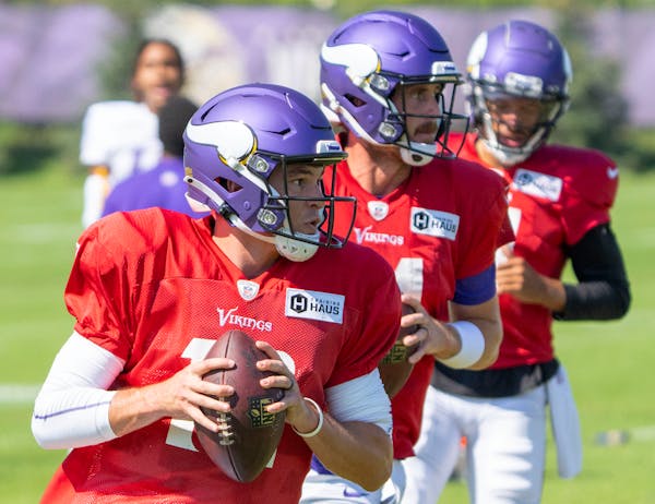 Nick Mullens, front, joined fellow Vikings backup quarterbacks Sean Mannion, center, and Kellen Mond at practice Tuesday.