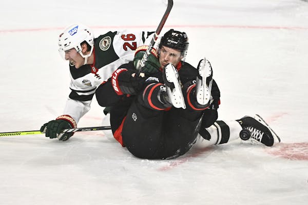 Connor Dewar of the Wild and Ottawa’s Dominik Kubalik collided during an NHL Global Series game in Stockholm on Saturday.