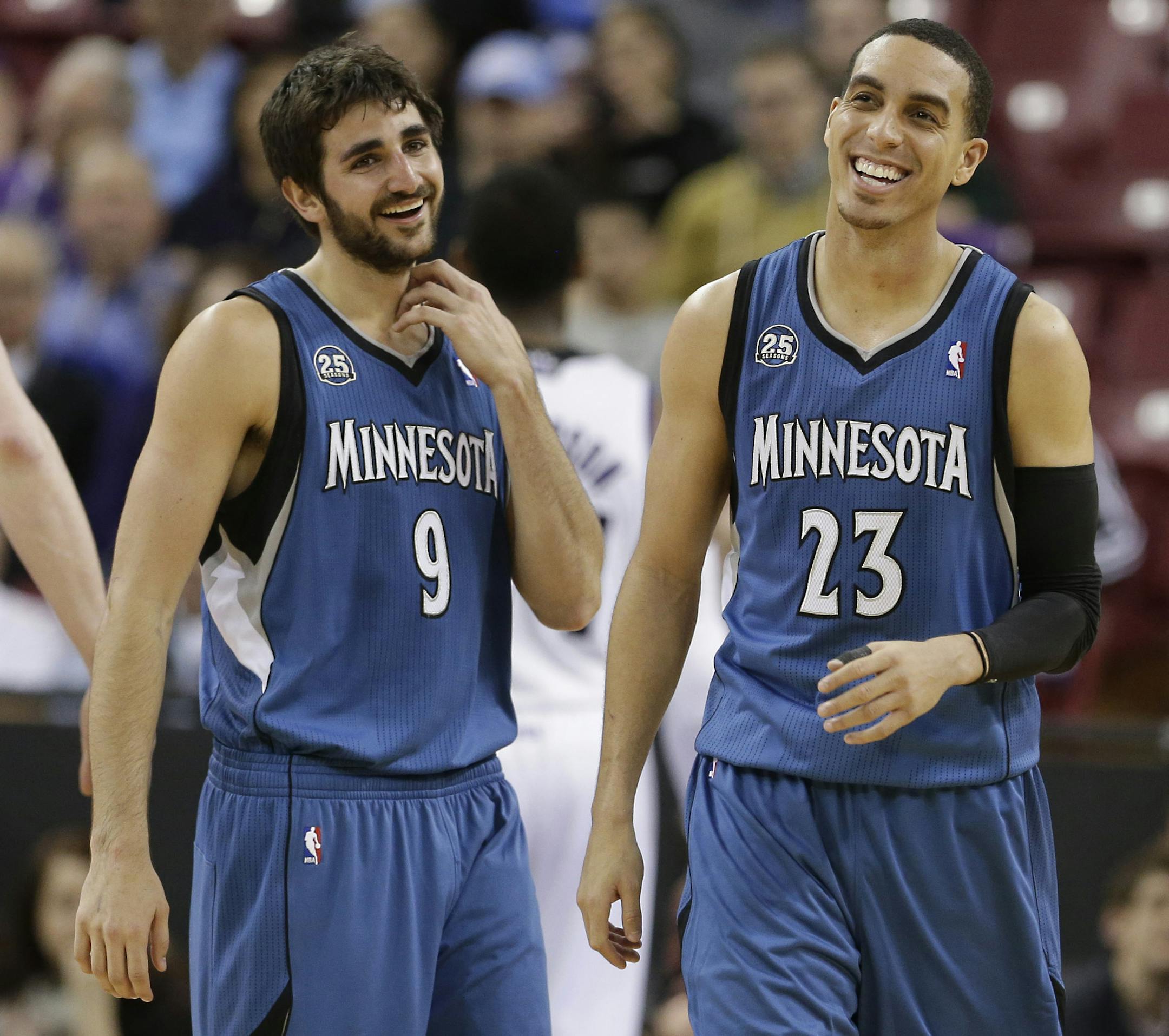 Minnesota Timberwolves' Kevin Martin, right, and Ricky Rubio, of Spain, laugh during the closing moments of the Timberwolves 108-97 win over the Sacramento Kings in a NBA basketball game in Sacramento, Calif., Saturday, March 1, 2014.(AP Photo/Rich Pedroncelli)