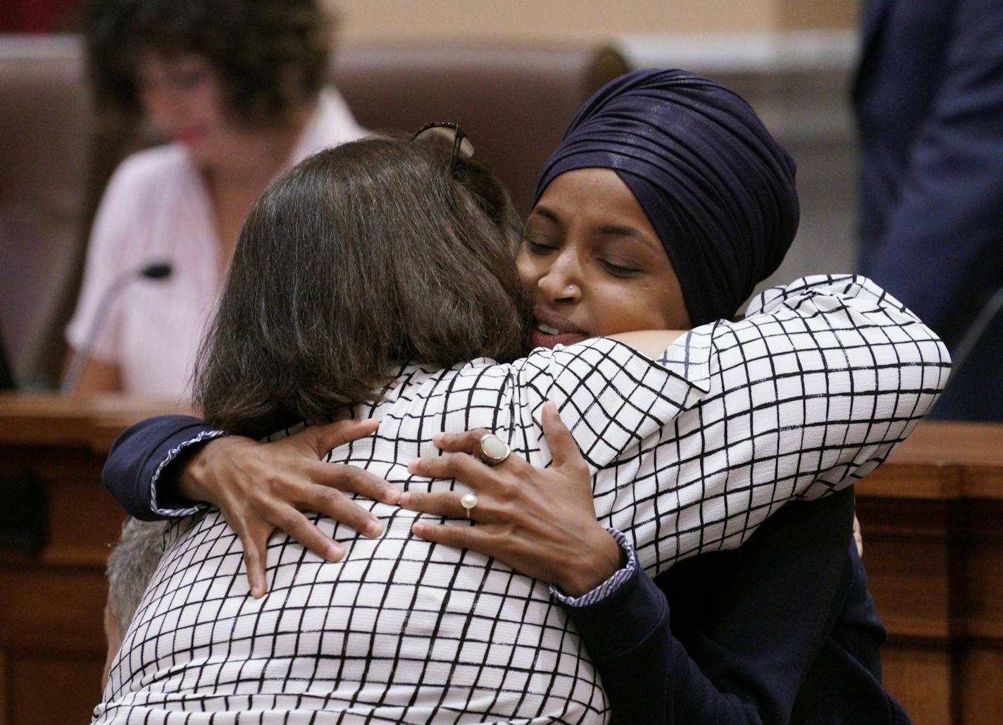 U.S. Rep. Ilhan Omar gave hugs and handshakes Thursday in the Minneapolis City Council Chambers before Minneapolis Mayor Jacob Frey's budget address.