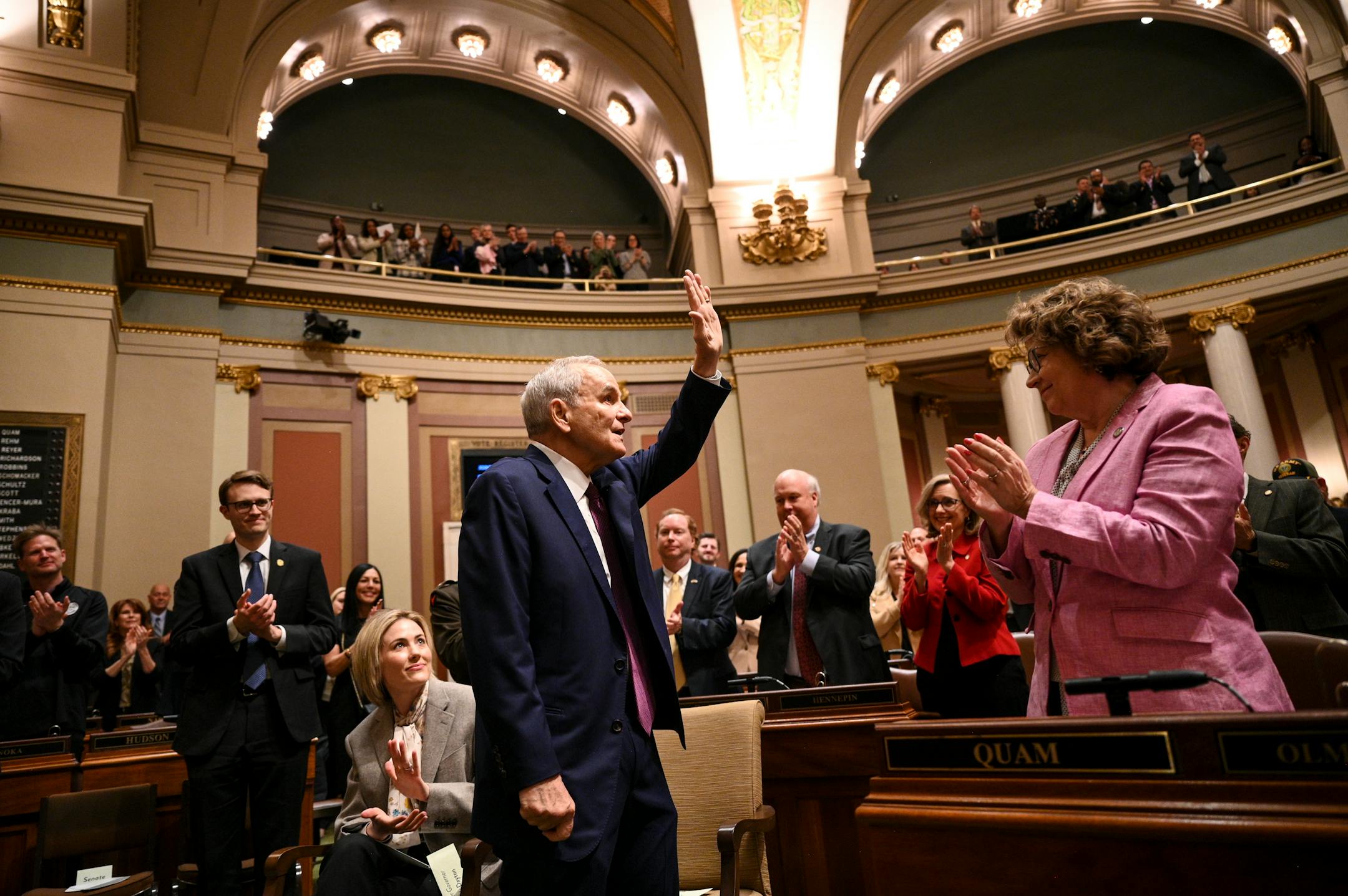 Former Minnesota Gov. Mark Dayton, the distinguished guest of the night, is recognized in the house chambers before the State of the State address.