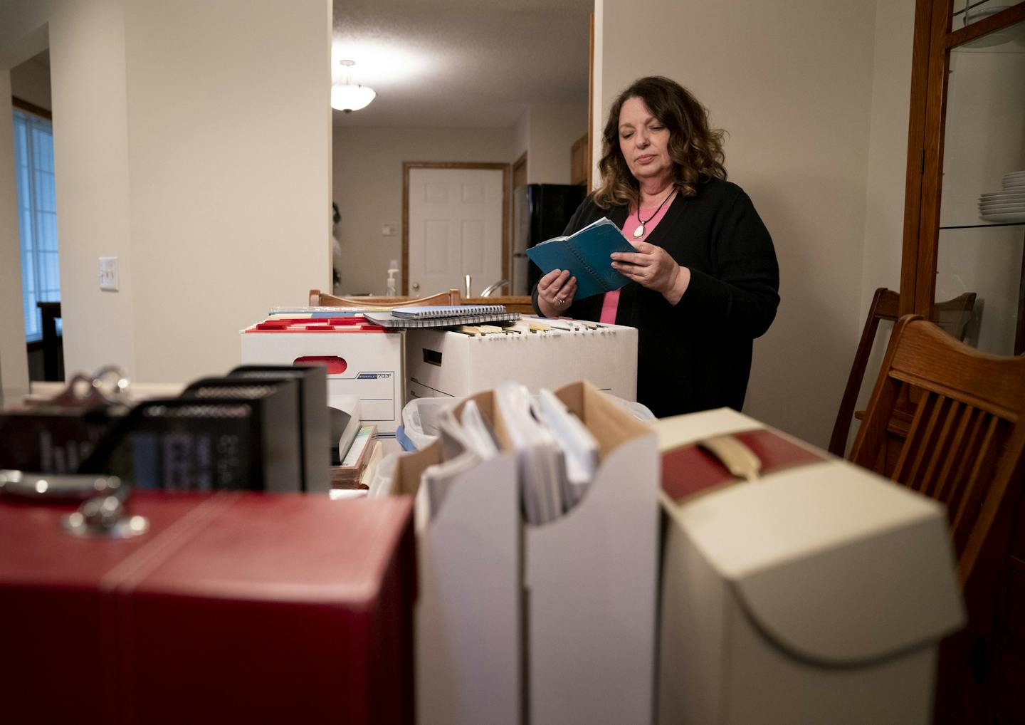 Tracey Kruse sold her Apple Valley Townhome in a bidding war after three days. She went through papers as she began to prepare her stuff to move at her townhome in Apple Valley, Minn., on Wednesday, May 8, 2019. ] RENEE JONES SCHNEIDER &#x2022; renee.jones@startribune.com