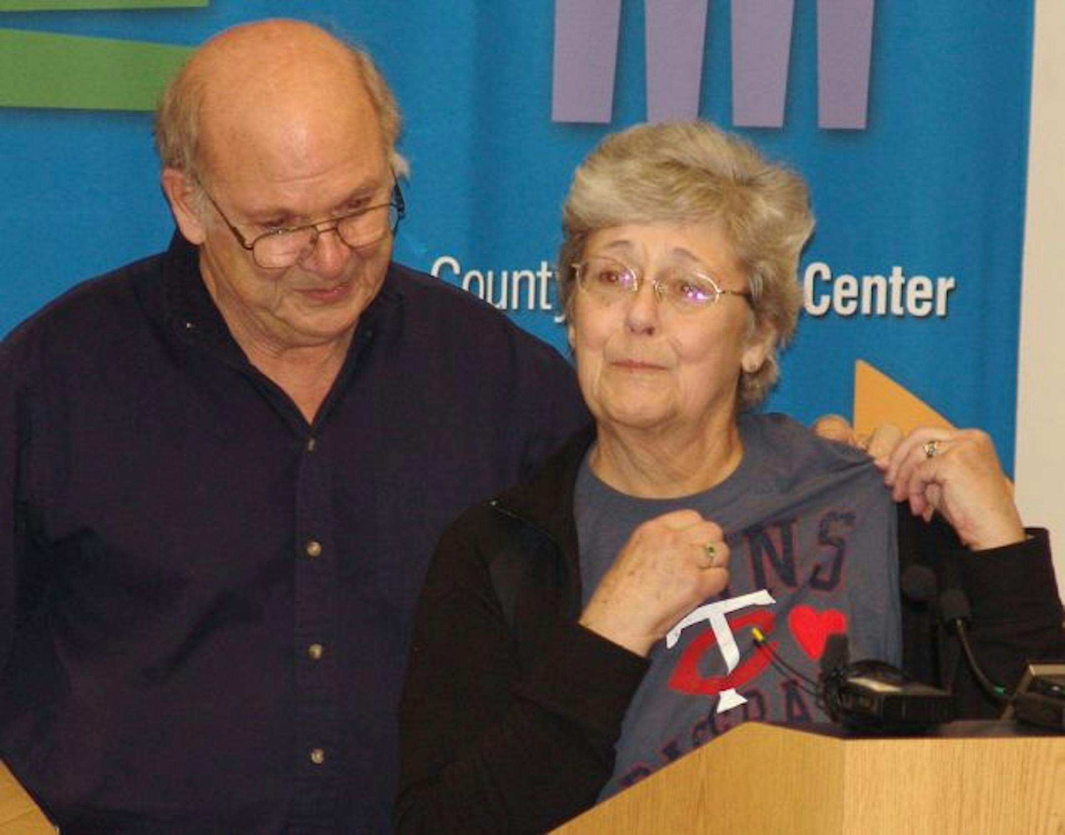 Pat Hall and her husband Bob posed for a photo Wednesday at a press conference at Hennepin County Medical Center where she thanked the first responders who administered CPR on her after she suffered cardiac arrest while at the Twins-Cleveland Indians game April 21. Pat Hall was wearing a Twins shirt with a heart on it and said "I have my Twins shirt with this heart, and I still have mine."
