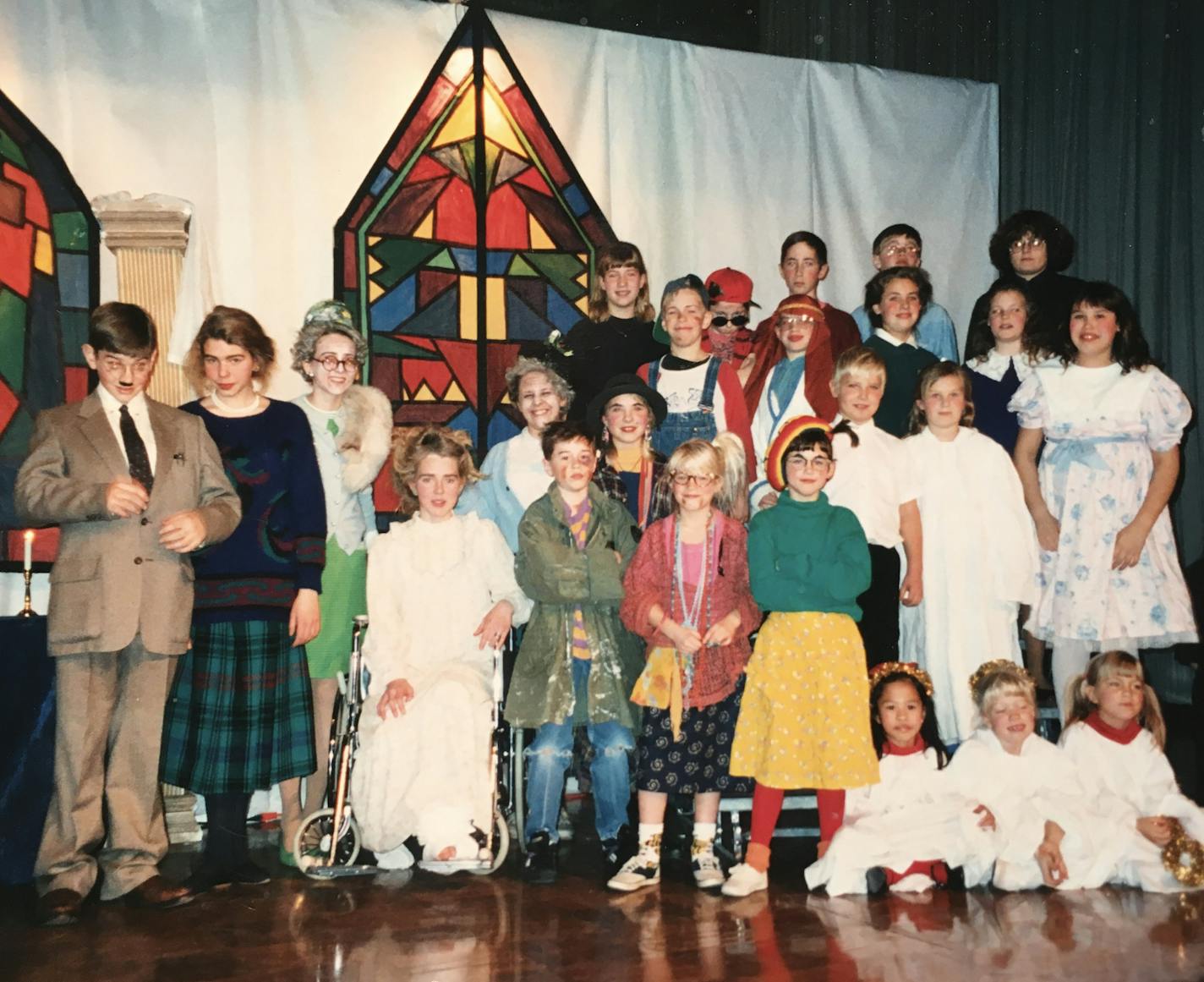 A cast photo of "The Best Christmas Pageant Ever" in 1993. "I was a freshman in high school," recalled Rasmussen, pictured second from left, next to her brother Paul. "I co-directed this show with my two best friends, Ailsa Staub next to me, and Hannah Staub in the chair. My brother Carl is in the overalls midcenter. We performed in the basement and then took this show on tour to the middle school."