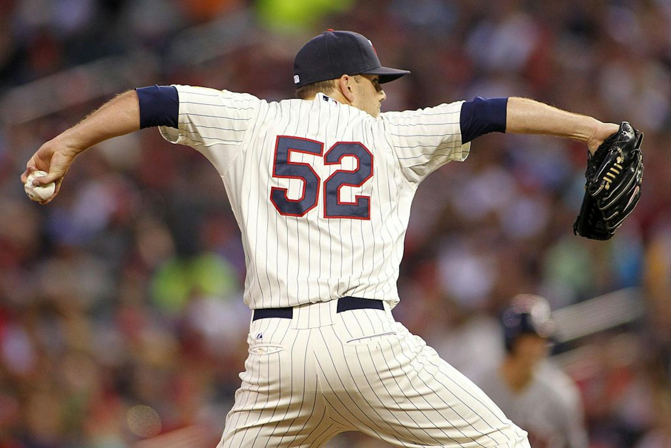 Minnesota Twins pitcher Brian Duensing throws to the Houston Astros in the 7th inning of their baseball game won by the Twins 6-4 in Minneapolis Saturday, Aug. 3, 2013.