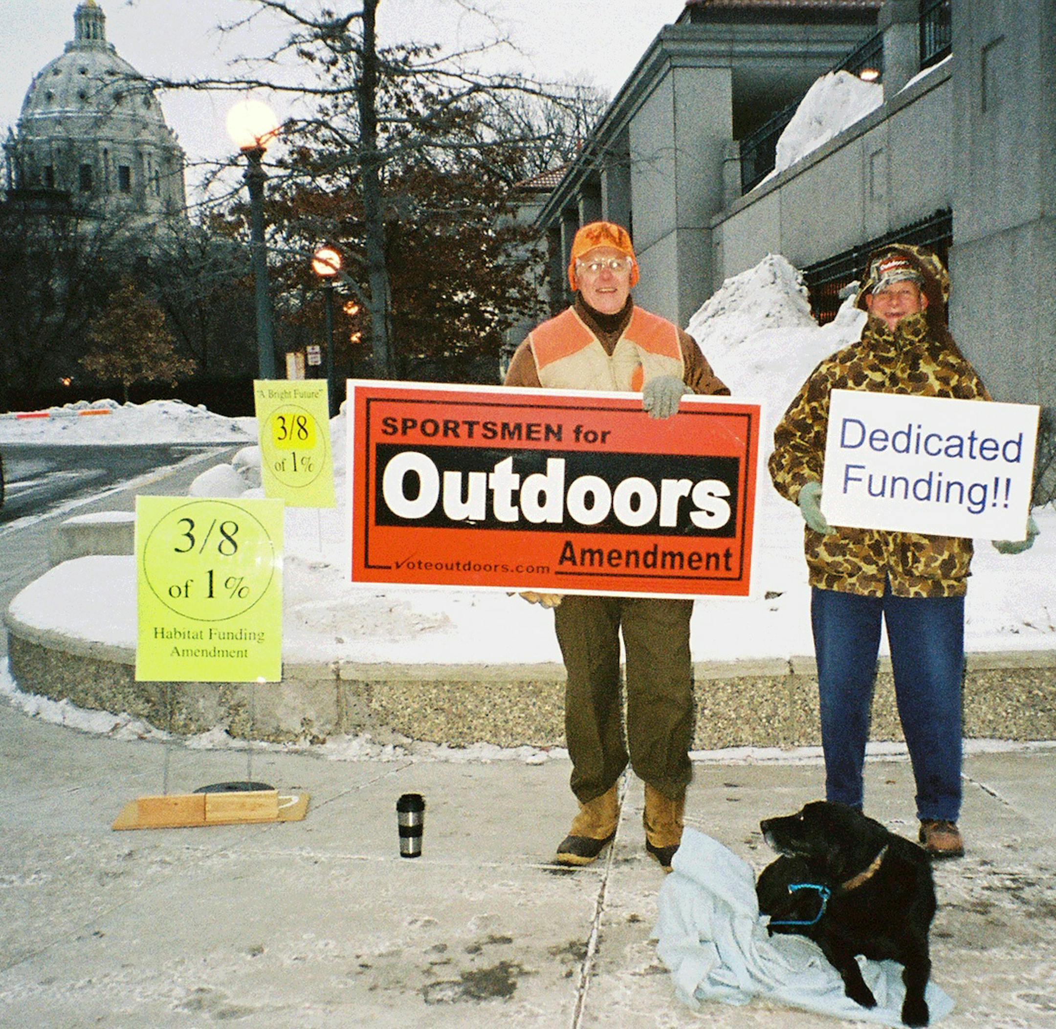Bob Kisch and Larry Sullwold showed their support for dedicated funding legislation at the State Capitol. The Legislature on Thursday approved putting the measure on the ballot in November.