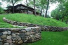 Landscape Renovations built new fieldstone walls, which replicate the remains of an original wall, on the lakeside of the two-acre property.