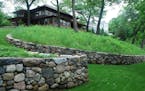 Landscape Renovations built new fieldstone walls, which replicate the remains of an original wall, on the lakeside of the two-acre property.
