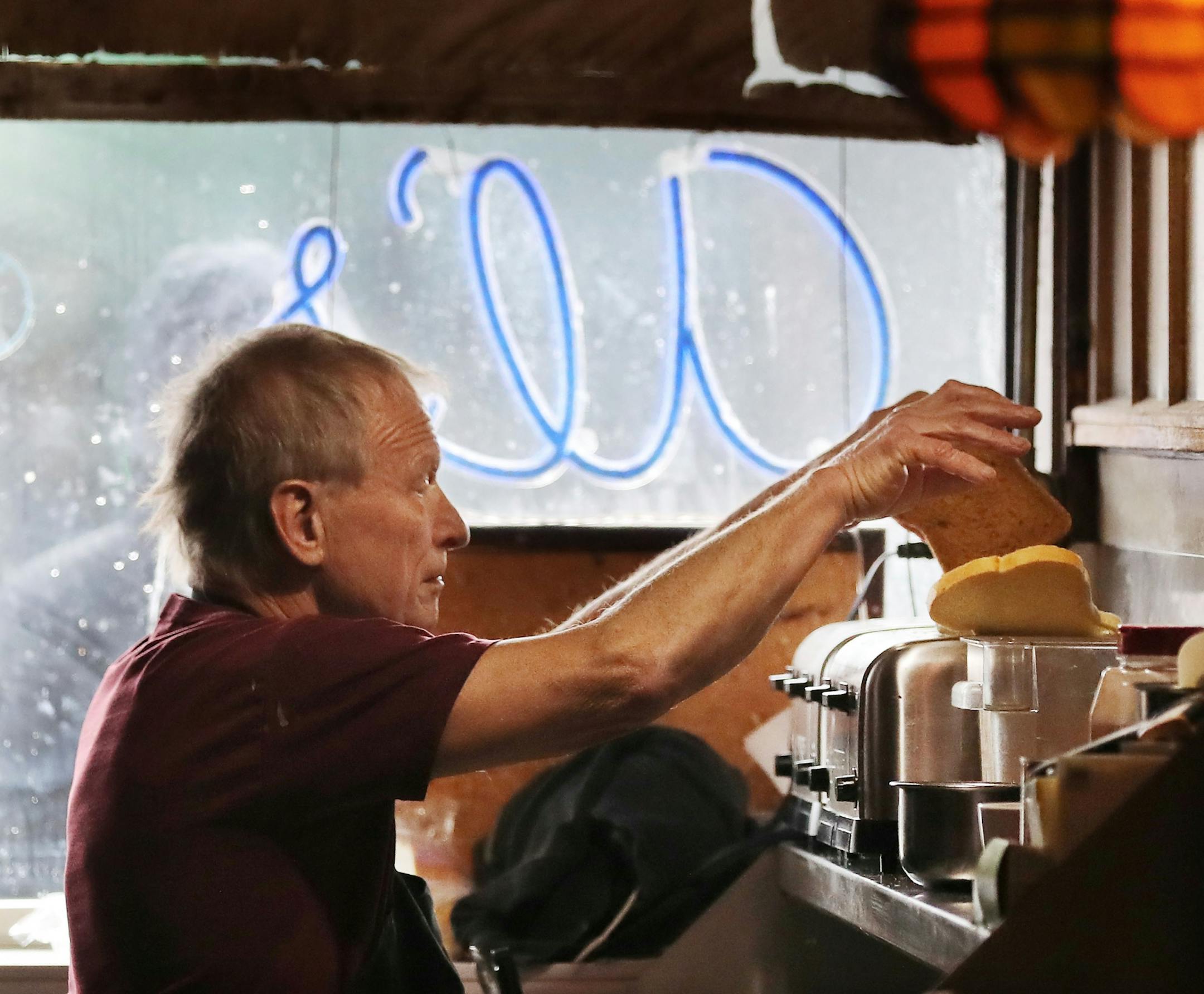 Doug Grina, a staple character at Al's Breakfast for 42 years, works behind the counter on Wednesday, Dec. 18, 2019.