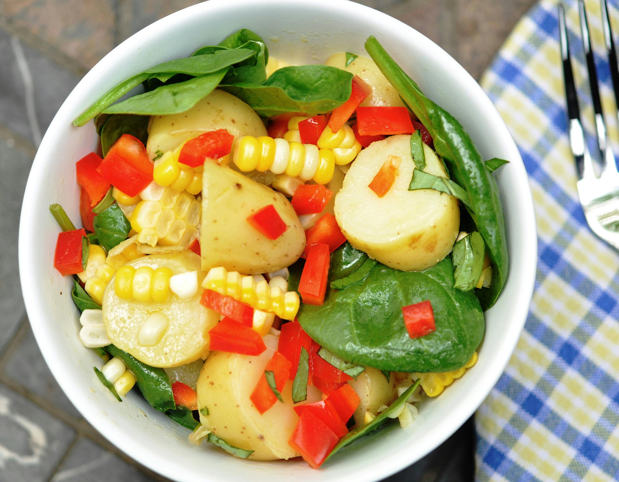 Meredith Deeds, Special to the Star Tribune Potato, Corn and Spinach Salad. For June 5 Taste cover story.