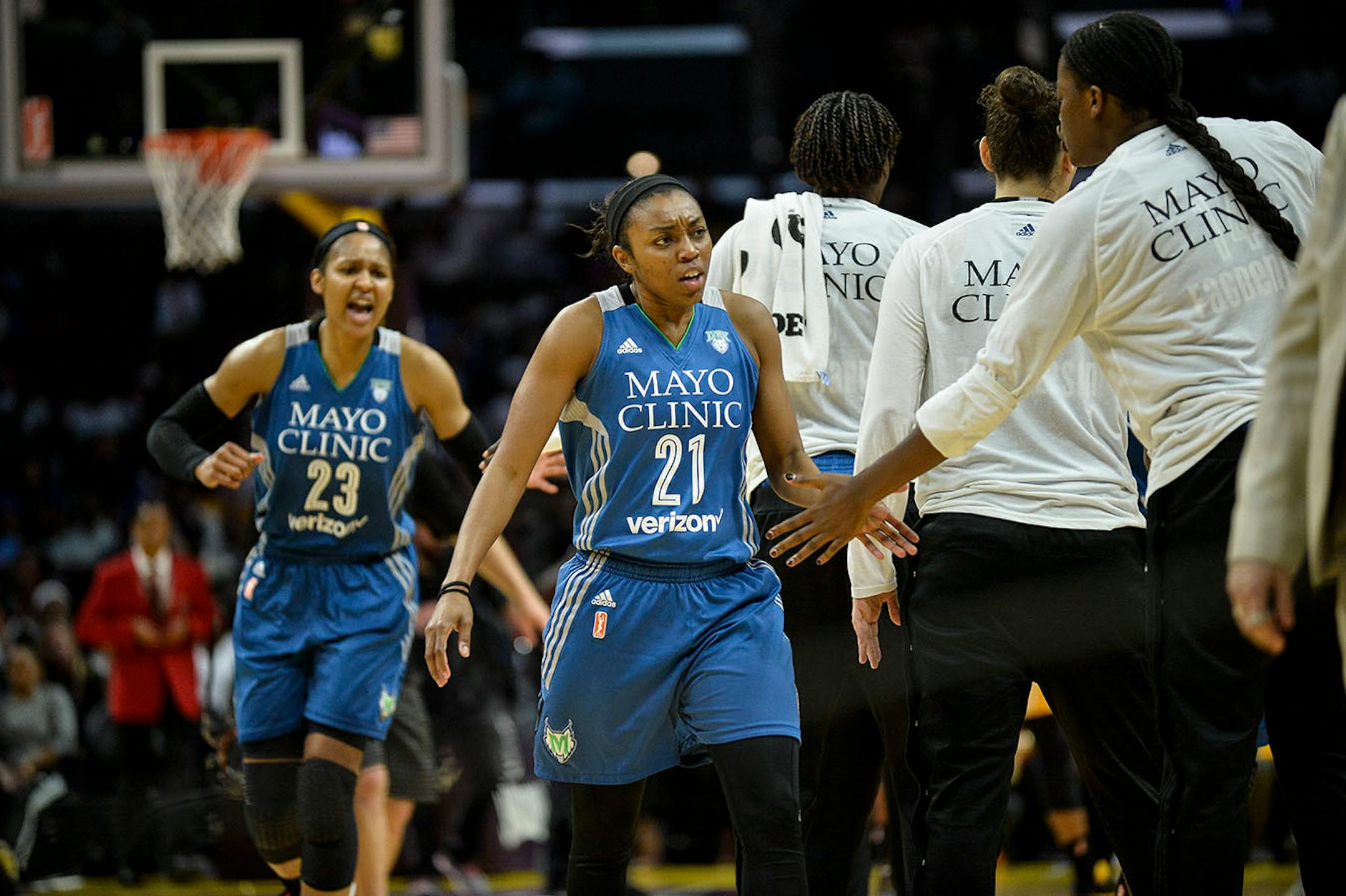 Minnesota Lynx guard Renee Montgomery (21) and forward Maya Moore (23) celebrated after the Los Angeles Sparks called a timeout after Minnesota carved out an early first half lead Sunday.
