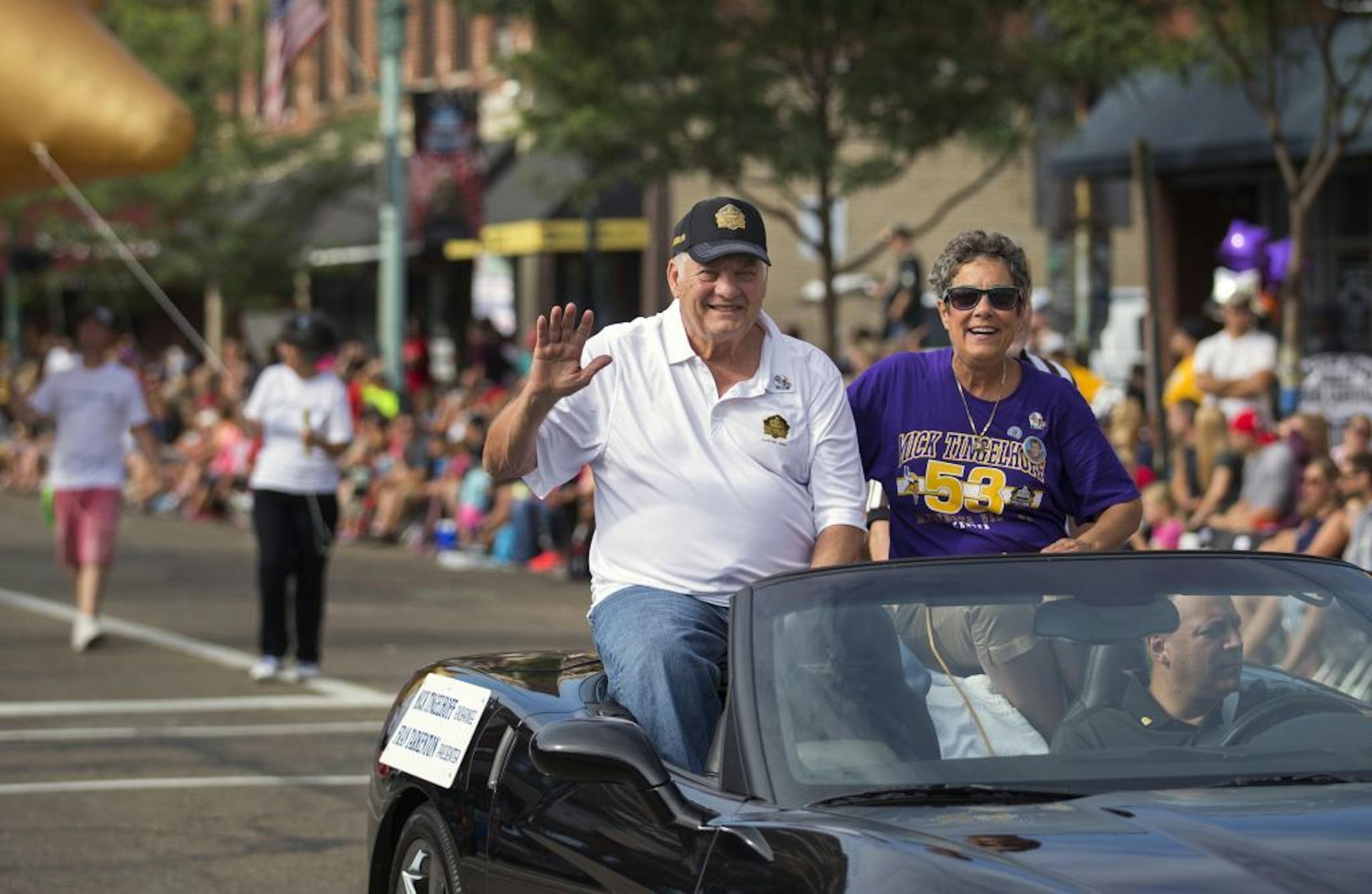 Mick Tingelhoff rode in the Grand Parade in downtown Canton Saturday morning with his daughter Teri.