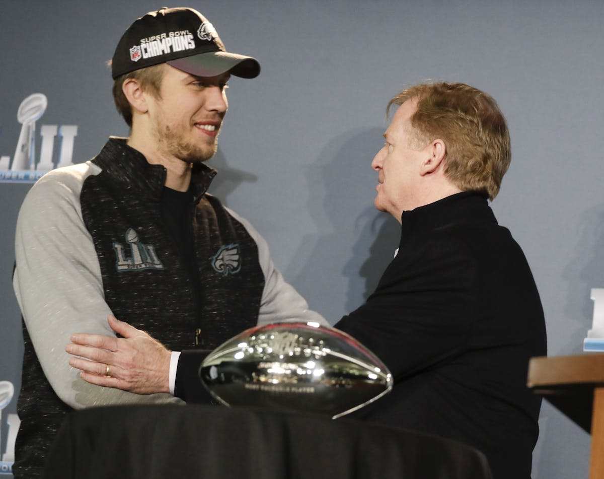 NFL Commissioner Roger Goodell and Eagles quarterback Nick Foles posed with his MVP trophy during a news conference after Super Bowl LII on Monday. Th