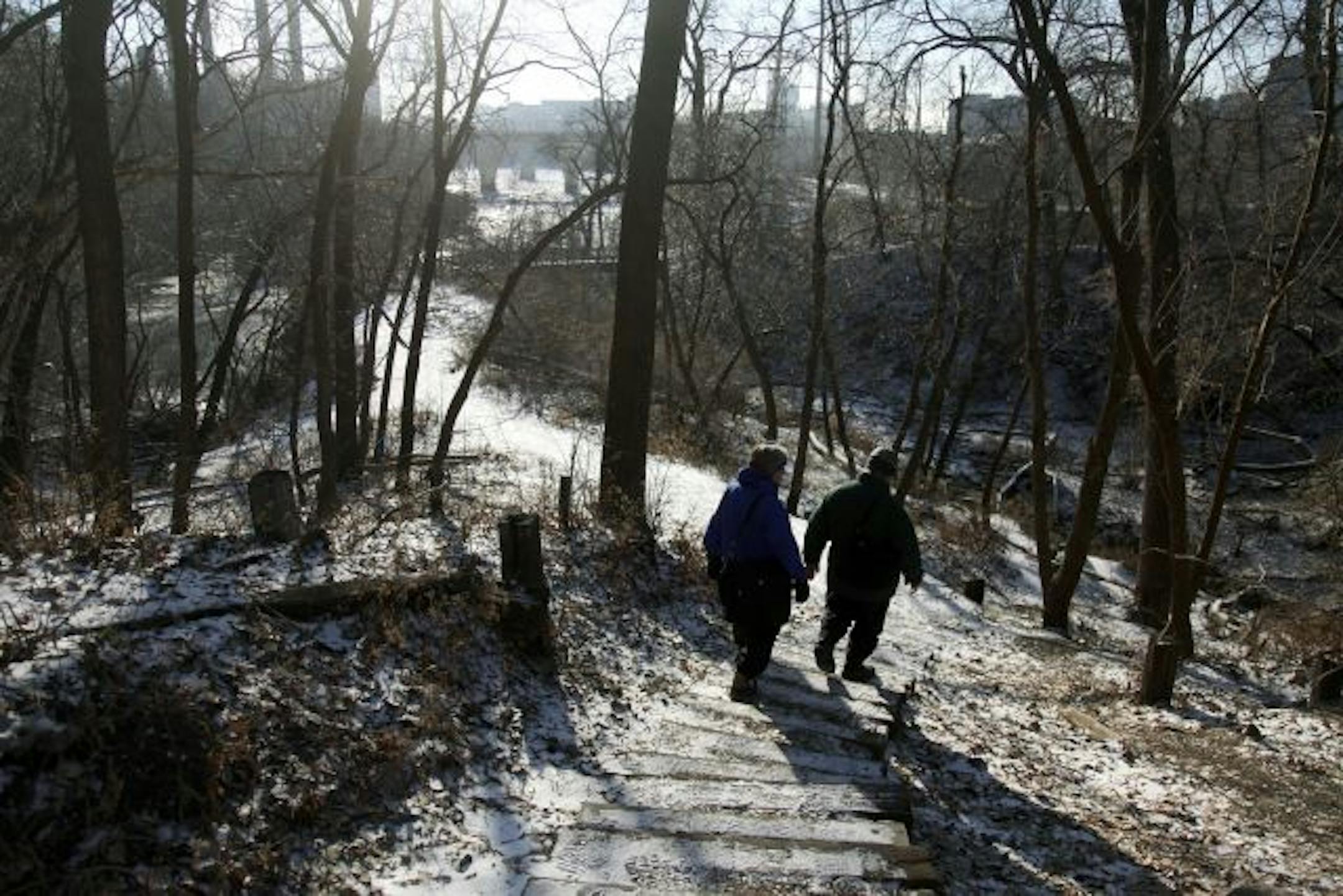 Cordelia Pierson, executive director of the Minneapolis Riverfront Corp., left, and David Wiggins, manager for the Mississippi National River and Recreation Area, gave a tour of the area where St. Anthony Falls once tumbled between Hennepin Island and the Mississippi River's east bank.
