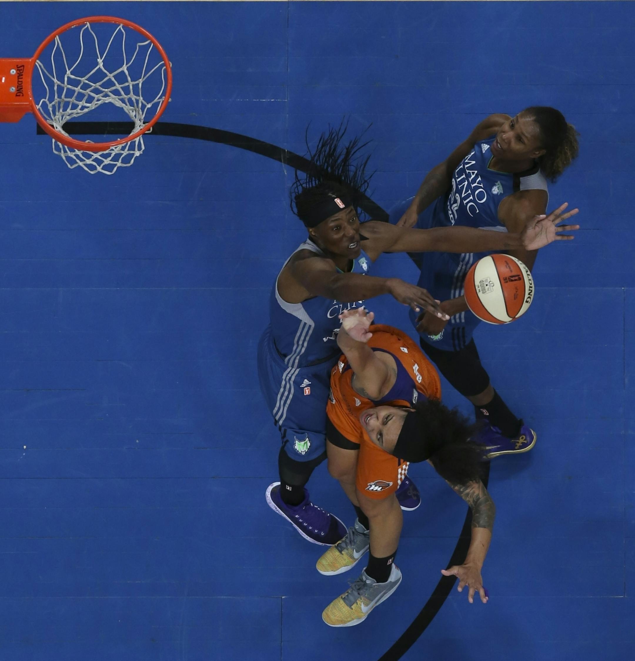 Minnesota Lynx center Sylvia Fowles (34) blocked a first half shot by Phoenix Mercury forward Candice Dupree (4).
