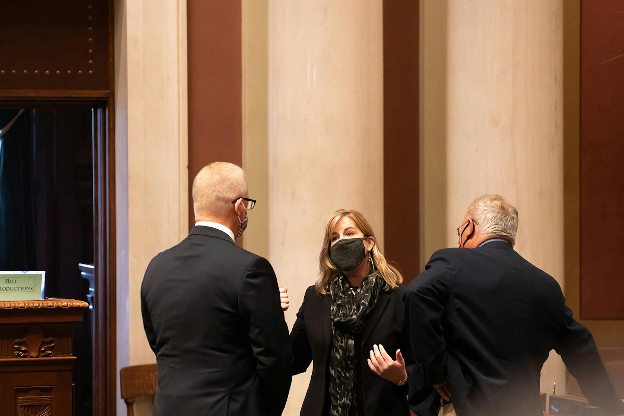 House Speaker Melissa Hortman, DFL-Brooklyn Park spoke with Rep. Jim Nash, R-Waconia, left and Rep. Dean Urdahl, R-Grove City, right, before the start the special session. Urdahl is the ranking Republican on the House bonding committee.