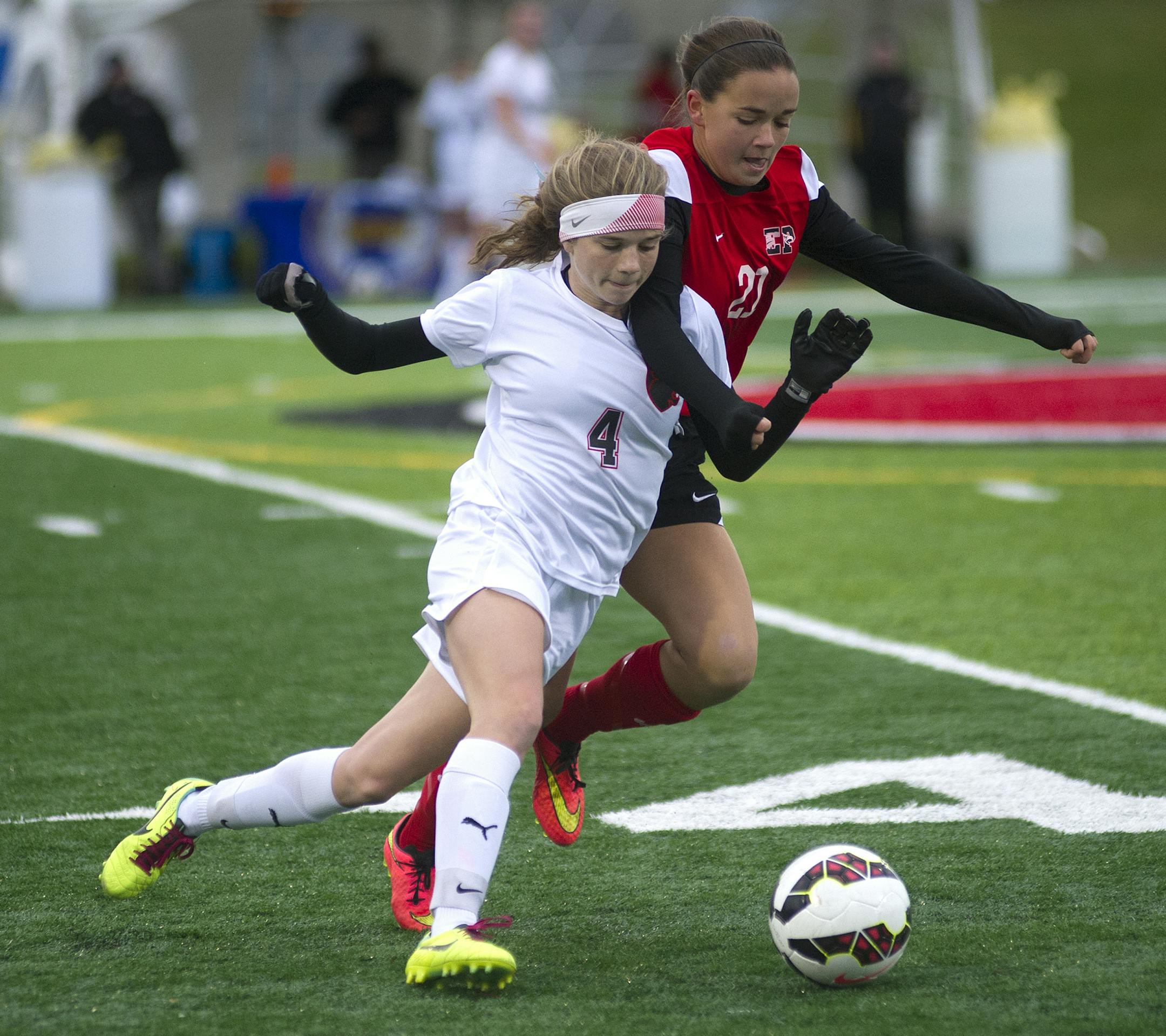 Lakeville North's Hannah Cade and Eden Prarie's Kelly Kruse battle for the ball during the second half of the Class 2A girls' soccer state semifinal Tuesday, October 28th, 2014 at Husky Stadium in St. Cloud, MN. ] (Matthew Hintz, 102814, St. Cloud)