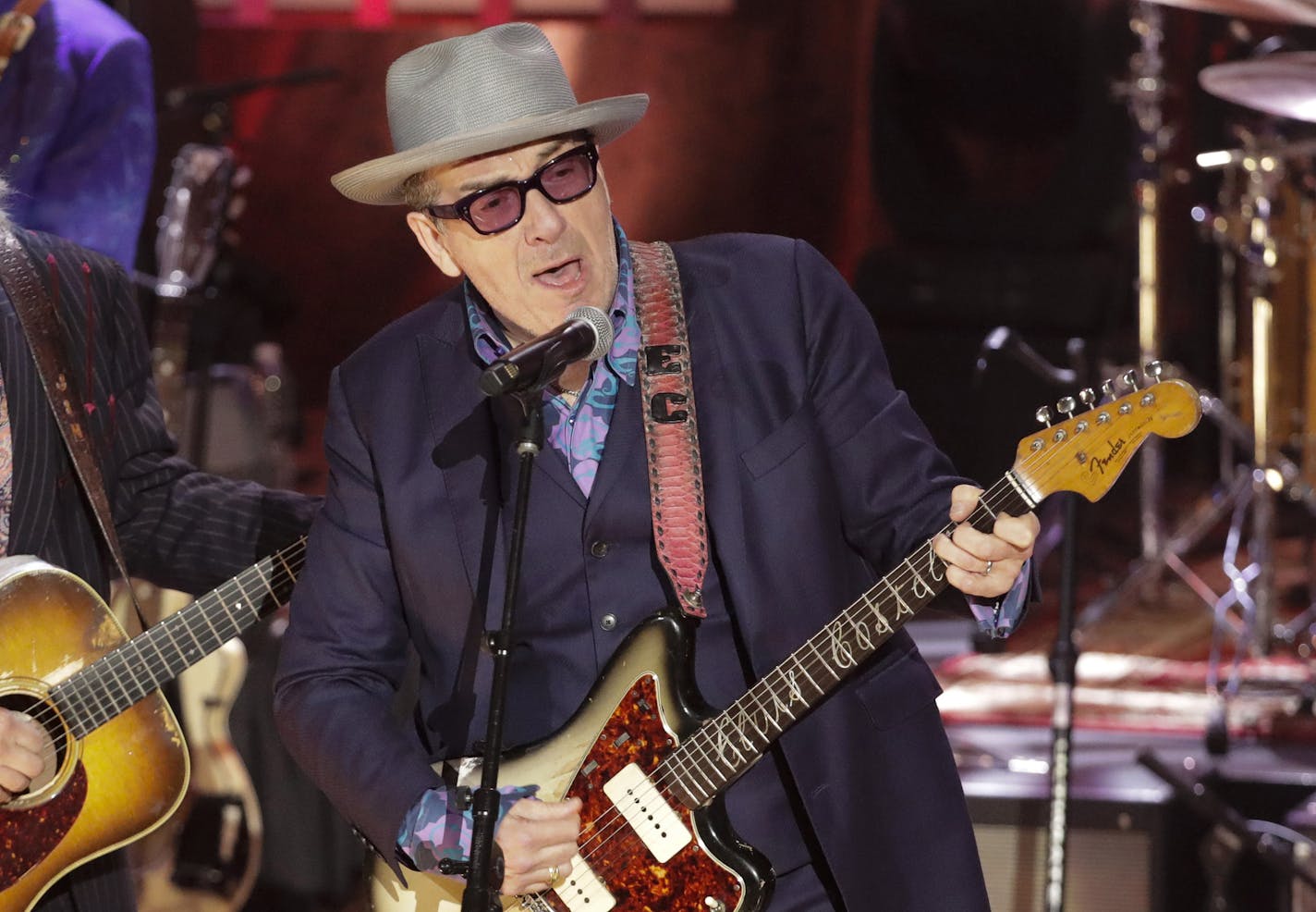 Elvis Costello, right, and Jim Lauderdale, left, perform during at the Americana Honors & Awards show Wednesday, Sept. 11, 2019, in Nashville, Tenn. (AP Photo/Wade Payne) ORG XMIT: TNMH197