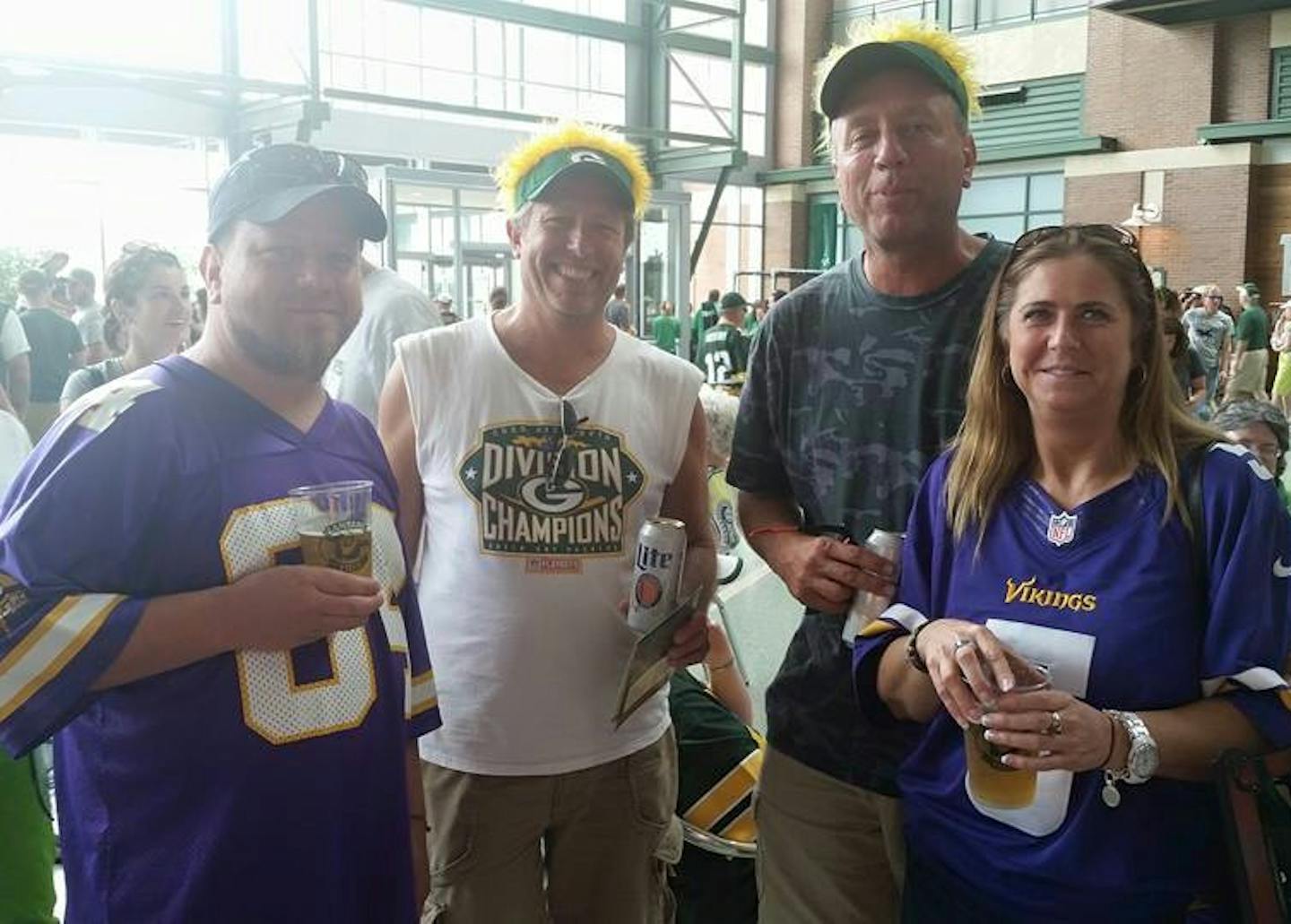 Bill Martin (left) and Lynn Webber (right) pose in their Vikings jerseys along with two Packers fans they met at Tuesday's shareholder meeting at Lambeau Field. Photo courtesy of Robert Martin (not pictured) ORG XMIT: PSBYNZYoMXn9vL9PUfVt