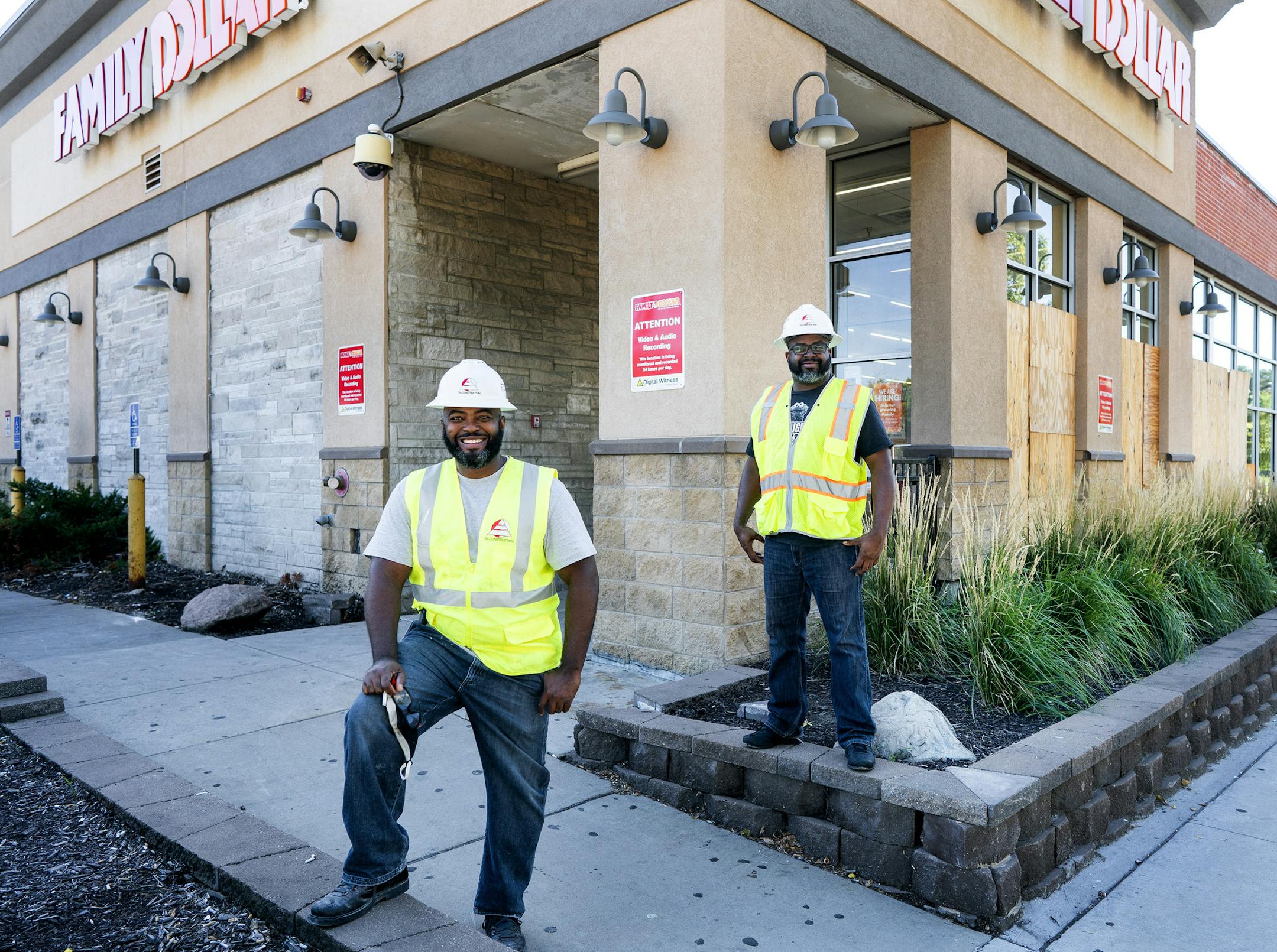 Lester Royal and Calvin Littlejohn, CEO of Tri-Construction, in north Minneapolis, where the firm is rebuilding a Family Dollar destroyed by riots.