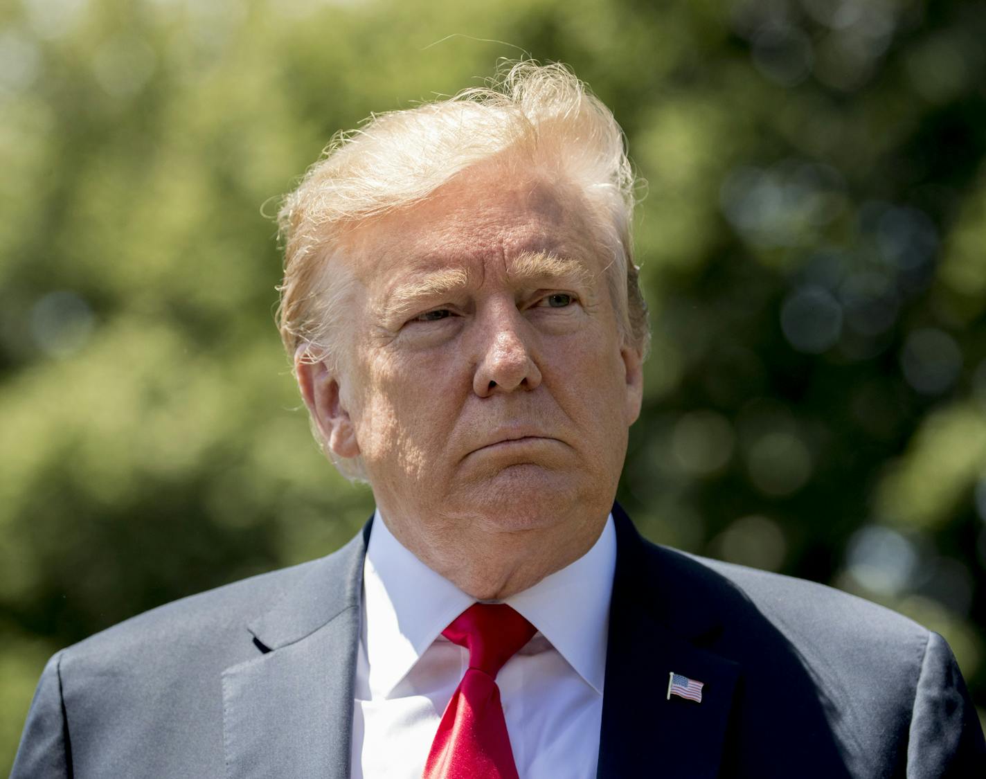 President Donald Trump takes a question from a member of the media on the South Lawn of the White House in Washington before his trip to Tokyo last month.