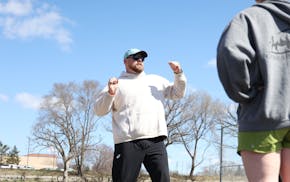 Two-time shot put Olympian Payton Otterdahl coaches throwers at Rosemount High School on Saturday, April 19, 2025.
