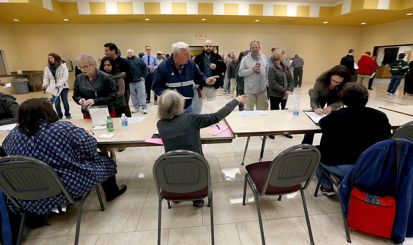 Voters lined at the polls at St. George Antiochia Orthodox Church, Tuesday, November 8, 2016 in West St. Paul, MN.