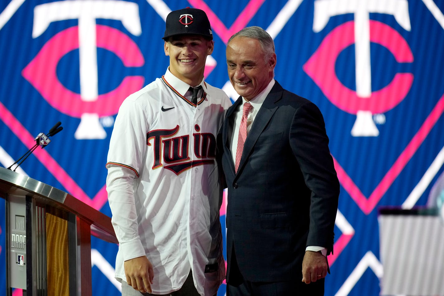 Mainland High School's Chase Petty stands with MLB Commissioner Rob Manfred after being selected by the Minnesota Twins as the 26th pick in the first round of the 2021 MLB baseball draft, Sunday, July 11, 2021, in Denver. (AP Photo/David Zalubowski)