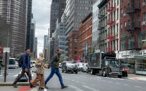 Pedestrians cross the street in New York on Friday, April 5, 2024. An earthquake shook the densely populated New York City metropolitan area Friday m