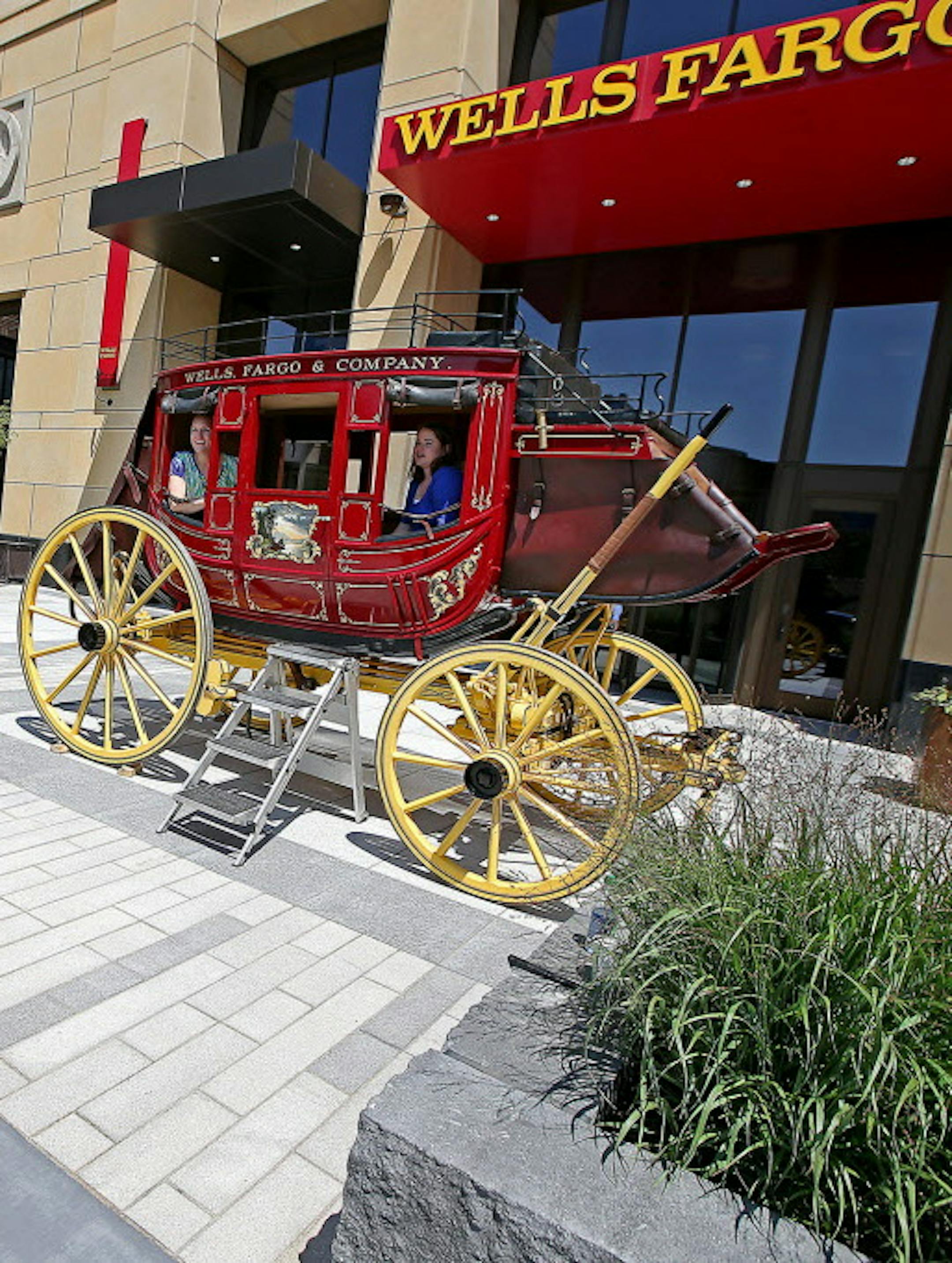 Wells Fargo employees and visitors visited and were photographed on the signature wagon as executives and city officials celebrated the grand opening of Minneapolis East Town Towers, Wednesday, July 20, 2016 in downtown Minneapolis, MN. ] (ELIZABETH FLORES/STAR TRIBUNE) ELIZABETH FLORES &#x2022; eflores@startribune.com
