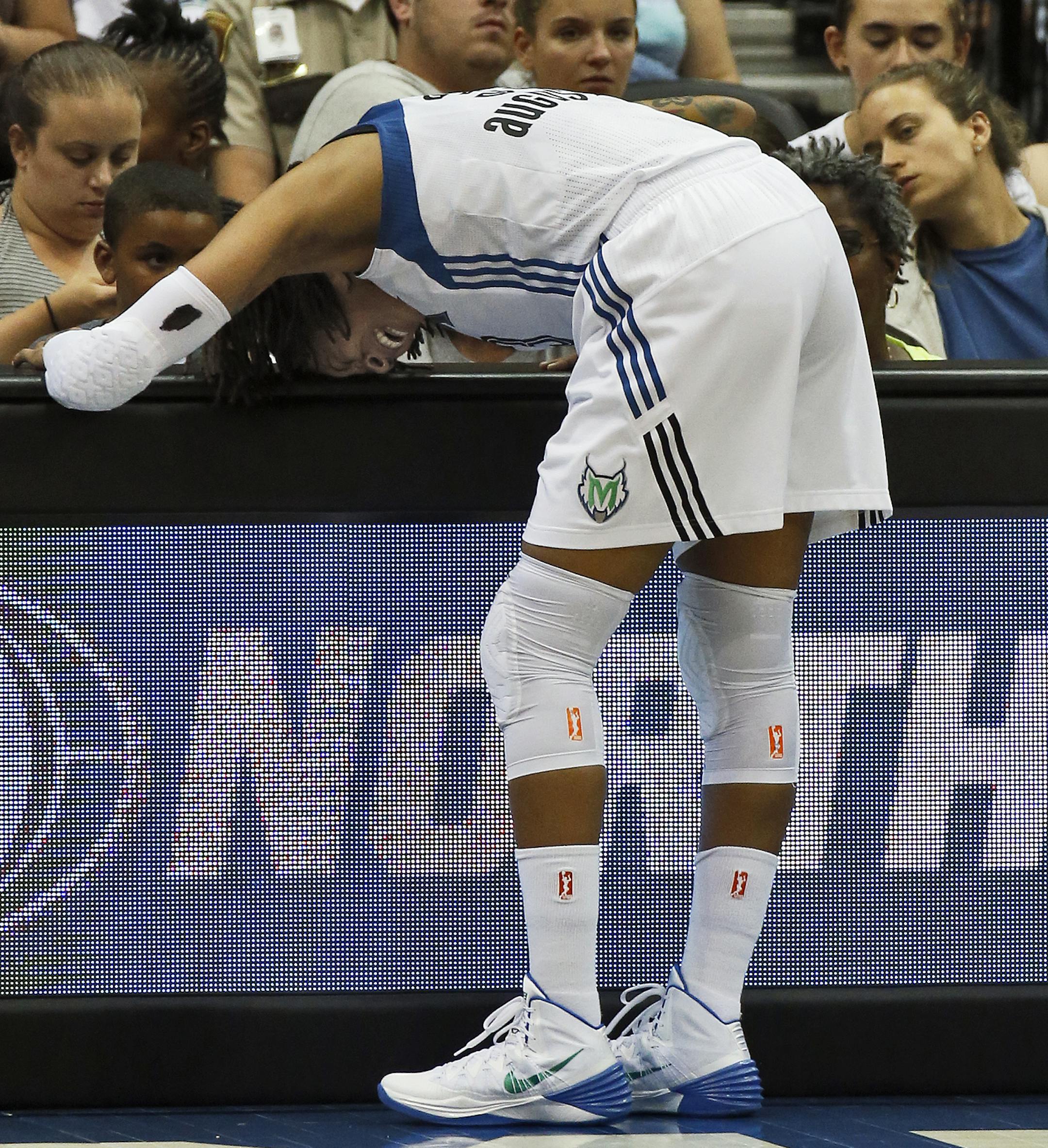 Minnesota Lynx vs. Phoenix Mercury. Lynx Seimone Augustus bent over in pain from an injury sustained in first half action forcing her to head to the locker room on crutches. (MARLIN LEVISON/STARTRIBUNE(mlevison@startribune.com