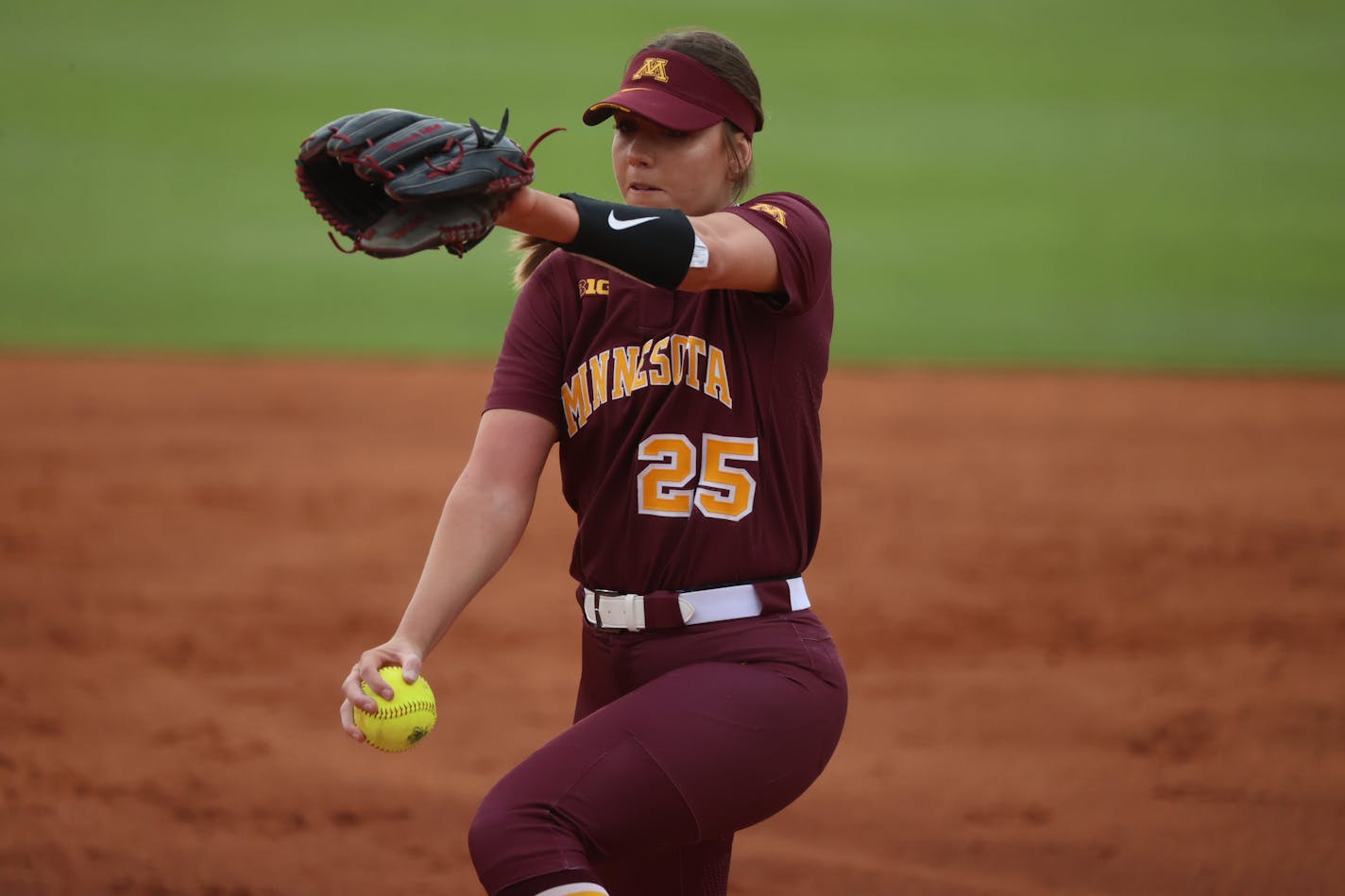 Gophers righthander Autumn Pease prepared to deliver a pitch against Texas A&amp;M on Saturday, May 21, 2022, in an NCAA softball tournament elimination game in Norman, Okla. (Craig Bisacre, University of Minnesota athletics)