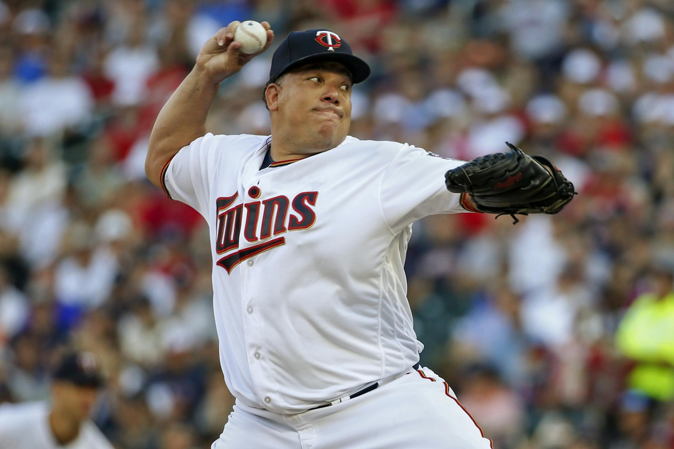 Minnesota Twins starting pitcher Bartolo Colon throws to the New York Yankees in the first inning of a baseball game Tuesday, July 18, 2017, in Minneapolis.